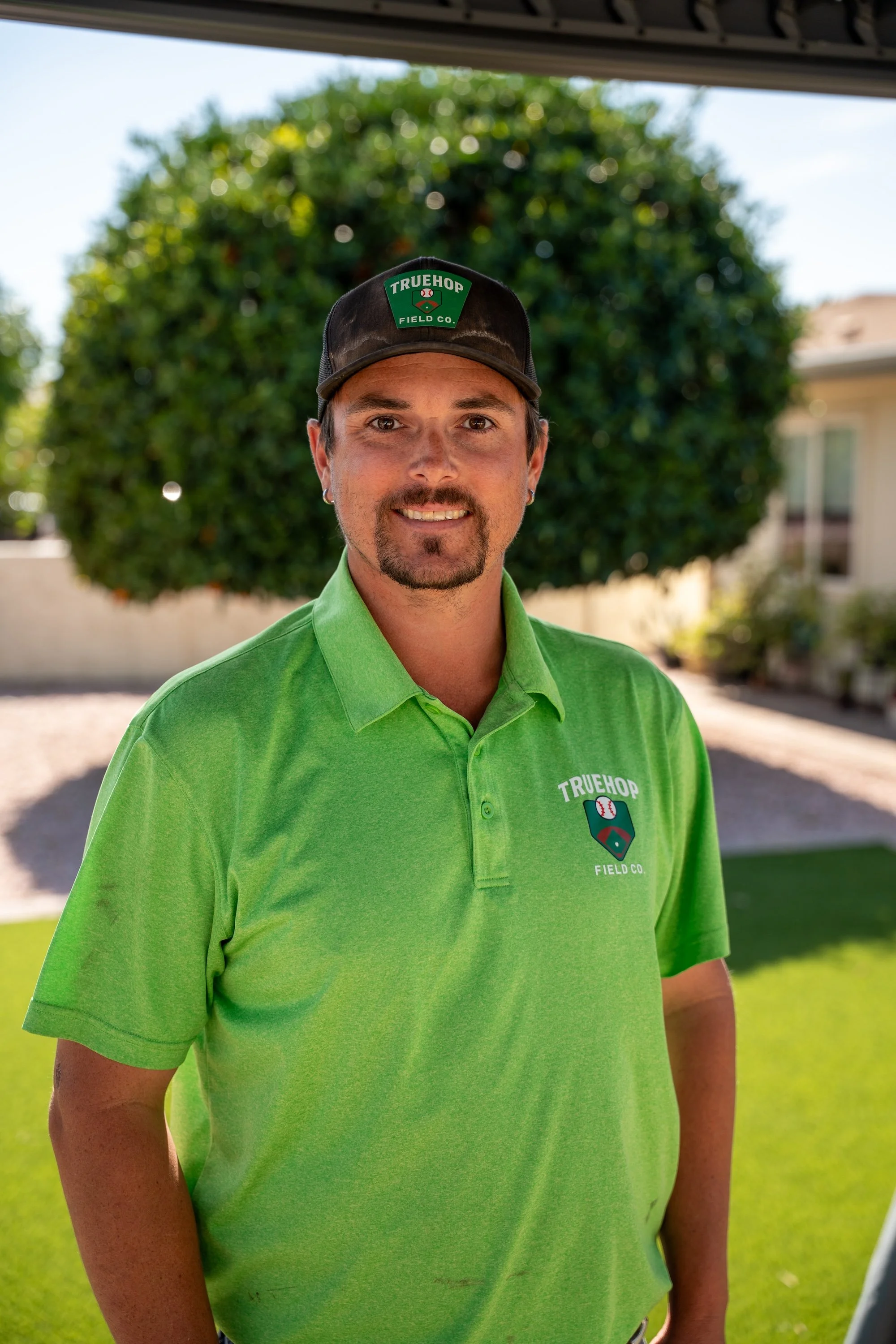 Headshot of Taylor Mapelsden, Project Manager of True Hopfield Co, an Arizona sports field & court construction company.