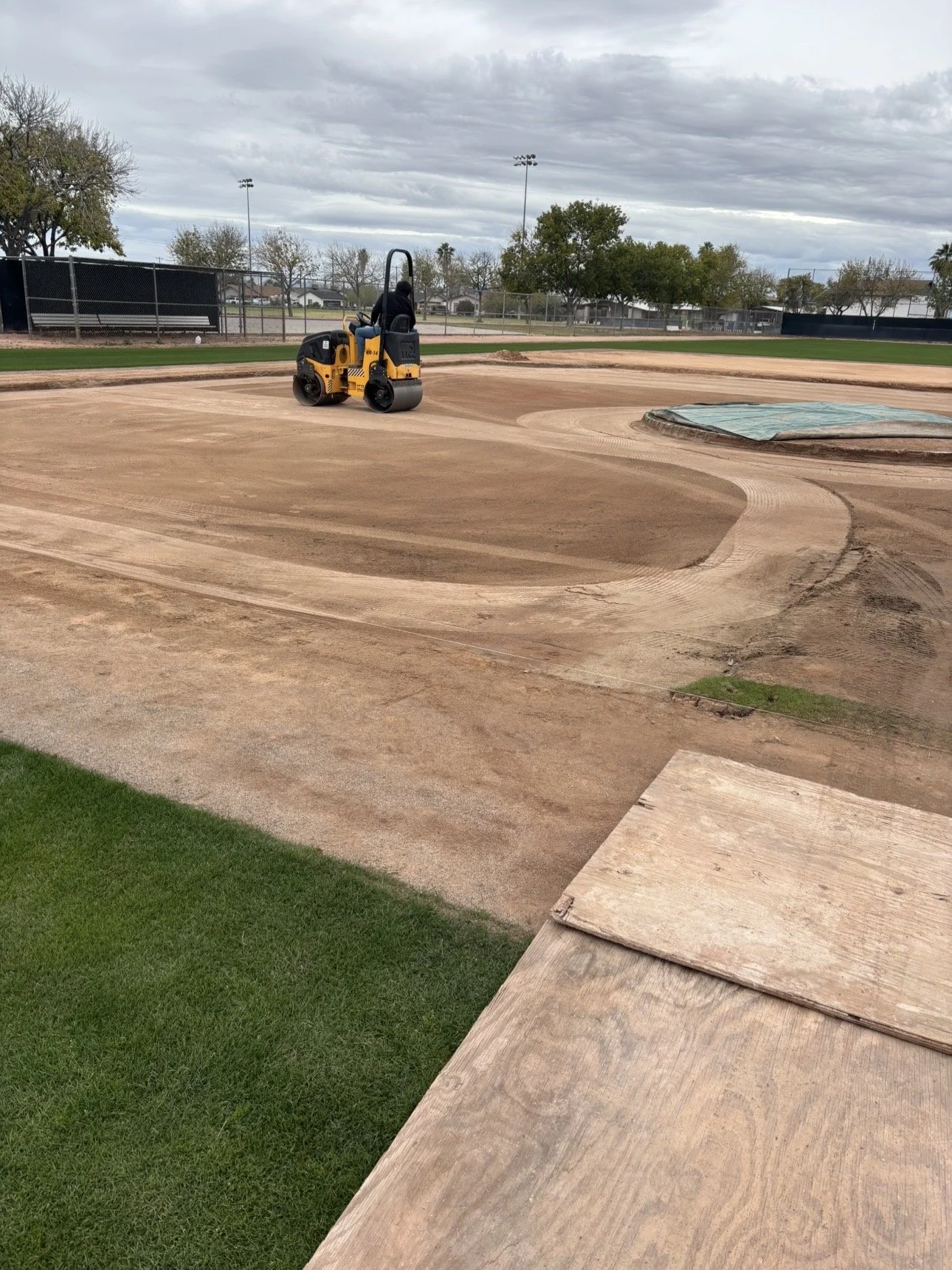 True Hop Field Co, Arizona sports field & court construction, team members working on a baseball field.