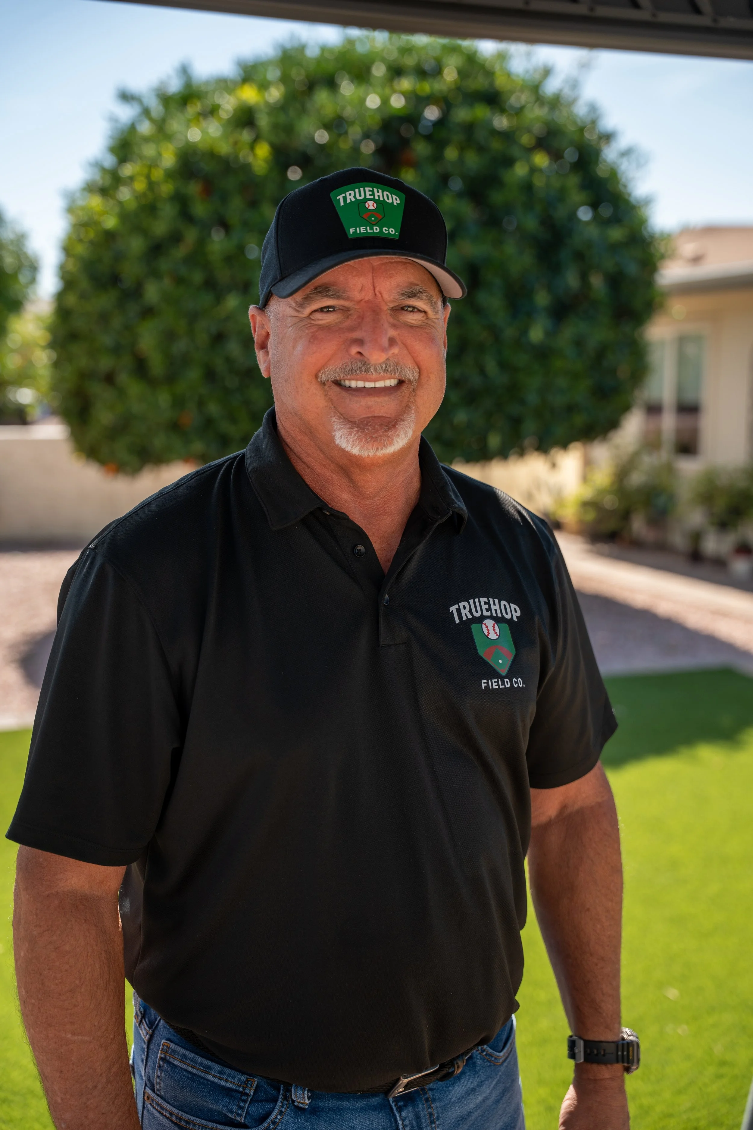 Headshot of Lou Torres, Chief Business Officer of True Hopfield Co, an Arizona sports field & court construction company.