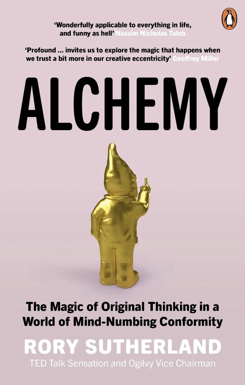Book cover for "Alchemy" by Rory Sutherland featuring a golden gnome with its back to the viewer, pointing upward. The cover includes quotes praising the book, with a pink background and the Penguin logo in the top right corner.