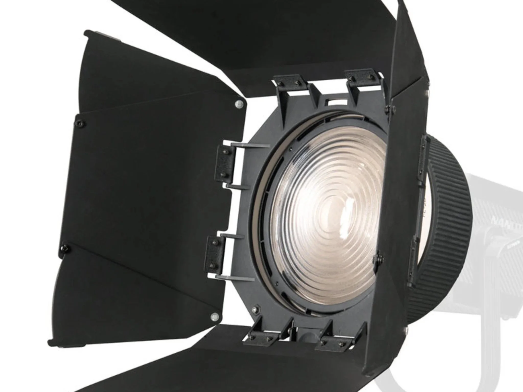 A professional studio spotlight with barn doors for controlling light direction, black in color, with a reflective interior and a large adjustable lens.