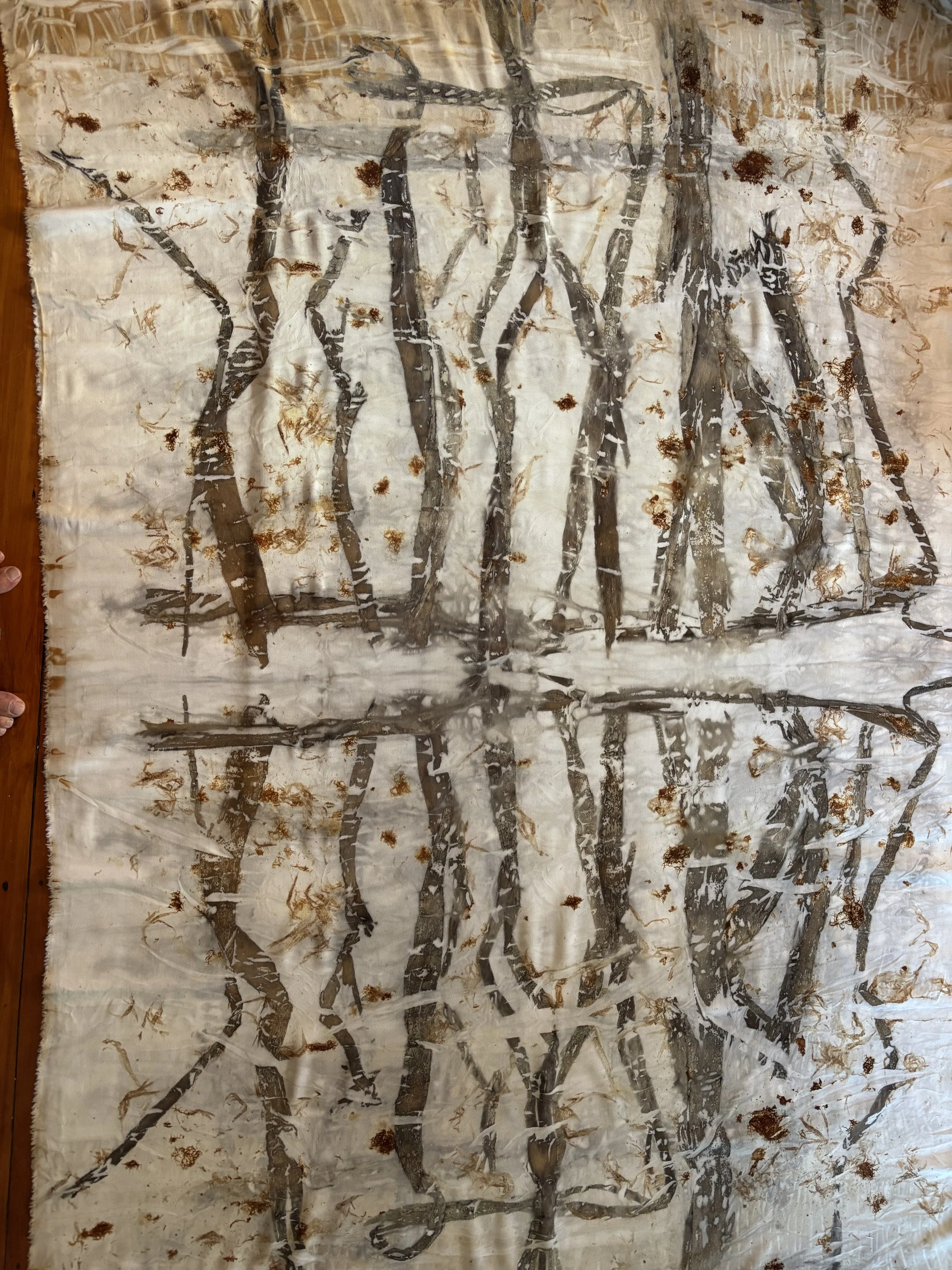 Abstract painting with black and brown lines and shapes on a white background, with brown splashes and dots scattered across the surface.