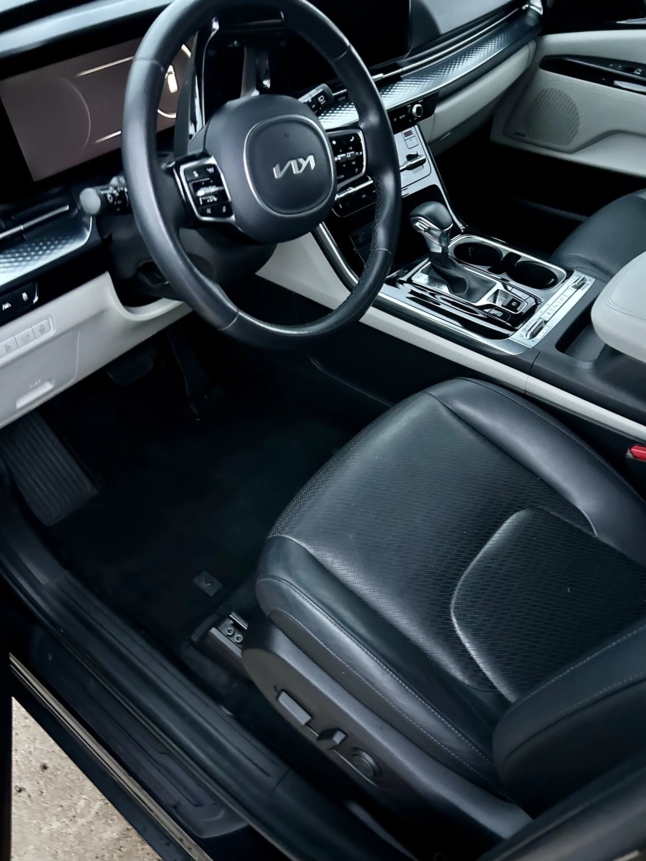 Clean car interior with vacuumed seats, wiped-down dashboard, and spotless windows after a Santo's Suds interior detail