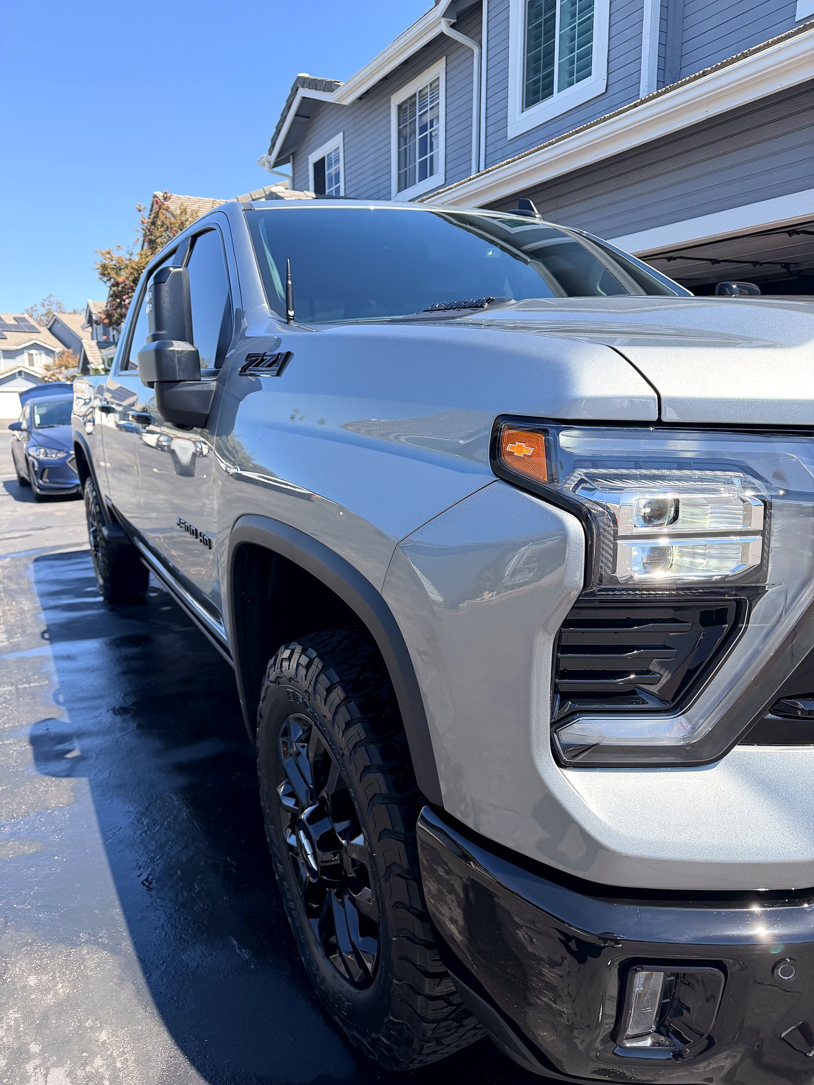 Silver Chevy Silverado HD truck after a full interior and exterior detail
