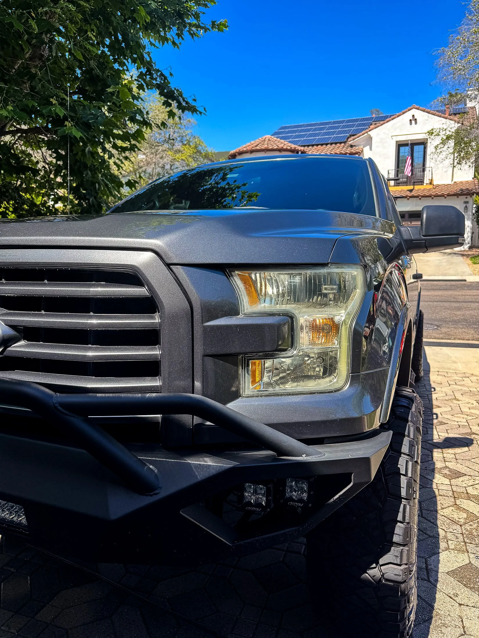 Lifted gray Ford F-150 with off-road bumper after a mobile truck detail
