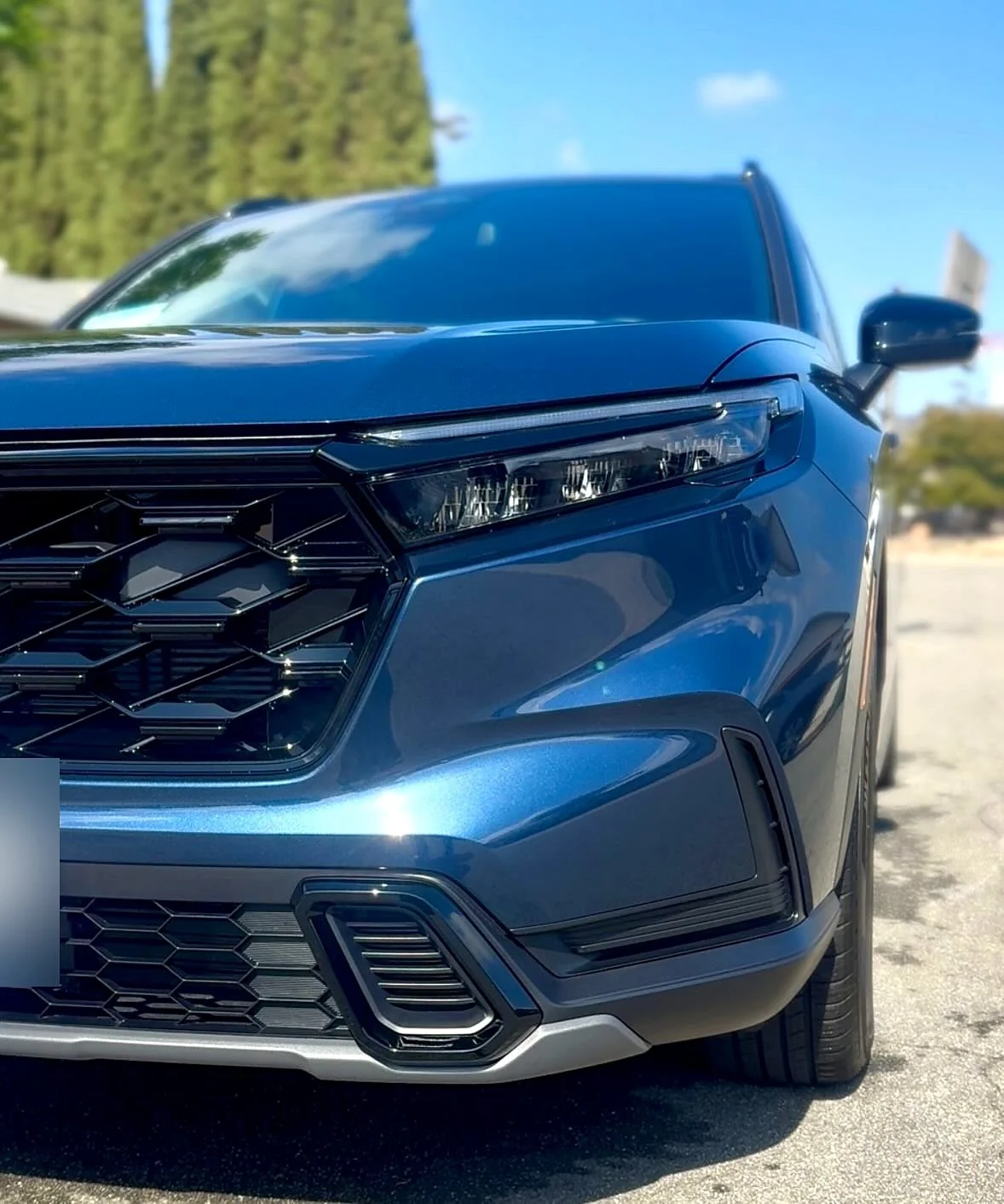 Blue Honda CR-V front end after a mobile exterior detail