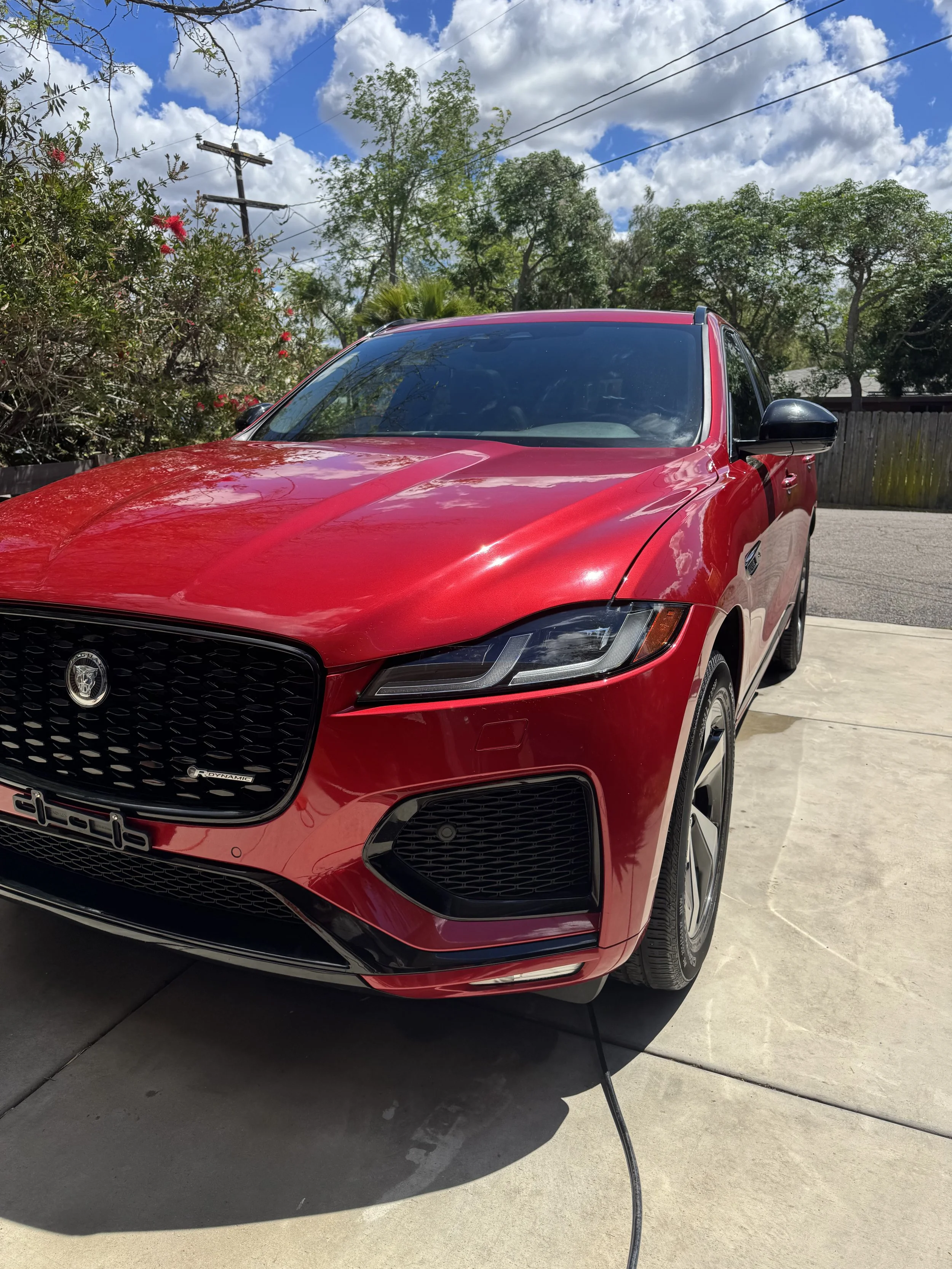 Red Jaguar F-Pace with glossy paint after a mobile car detail in Poway, CA
