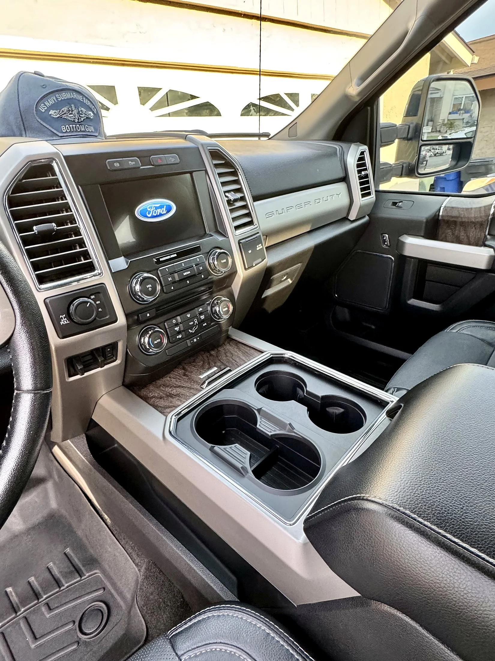 Clean Ford truck dashboard, cupholders, and console after an interior detail