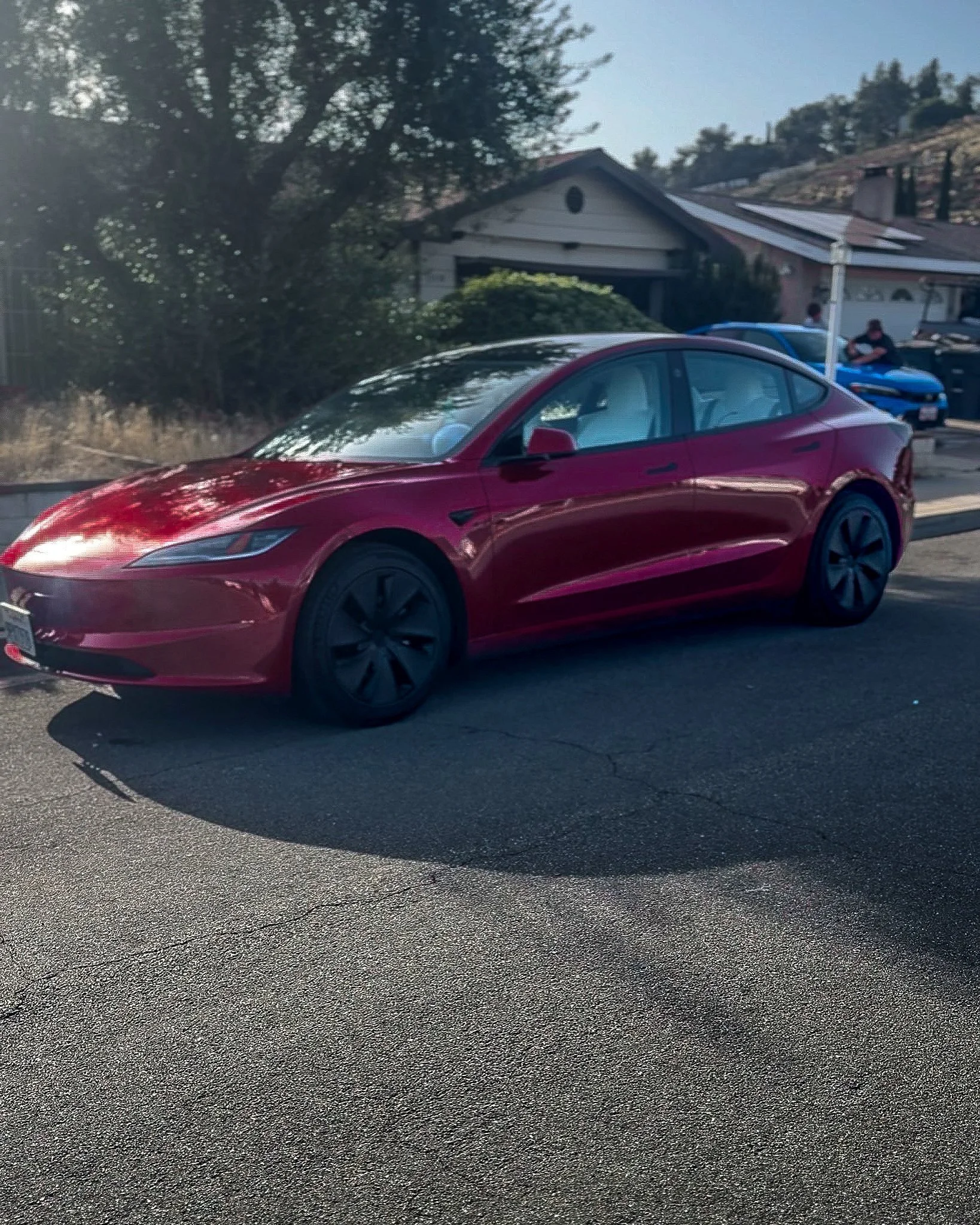 Red Tesla Model 3 after a mobile exterior detail