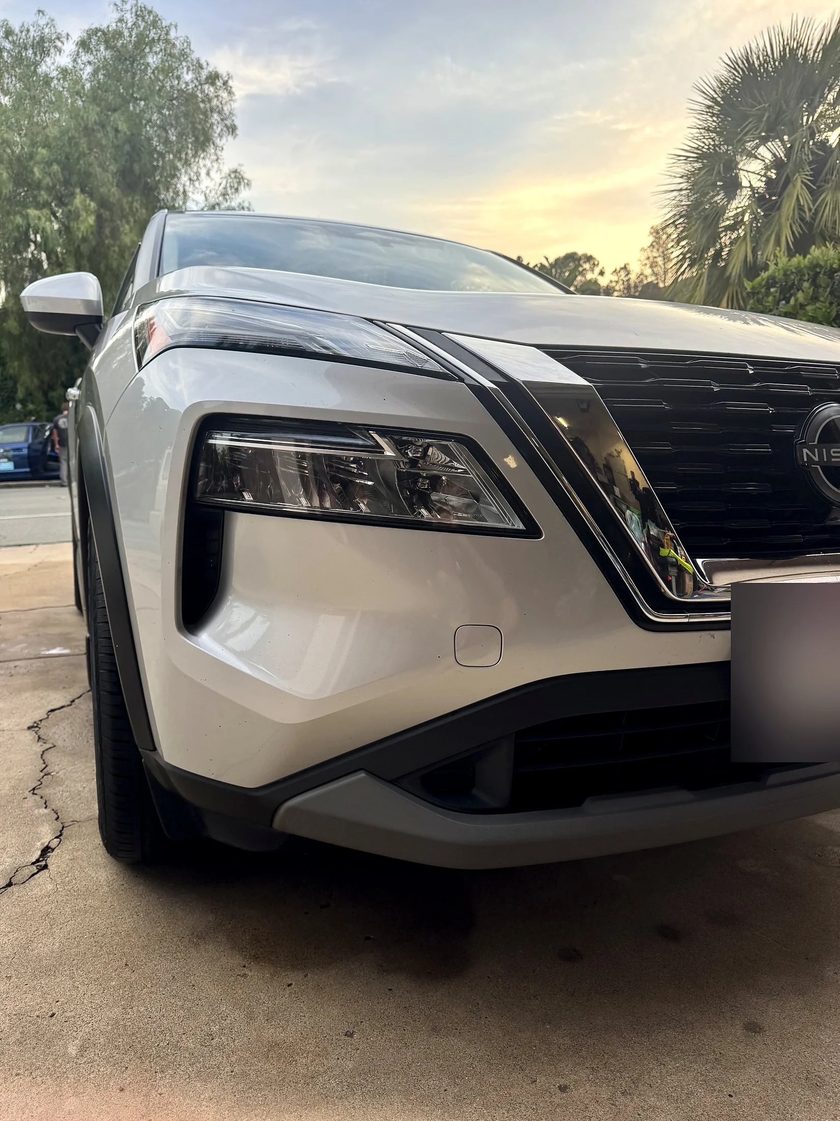 Silver Nissan Rogue front end after a mobile exterior detail