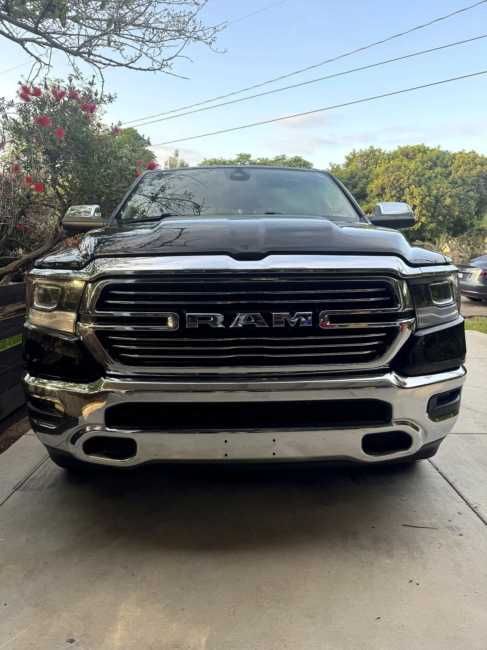 Black Ram 1500 truck with polished chrome grille after a detail