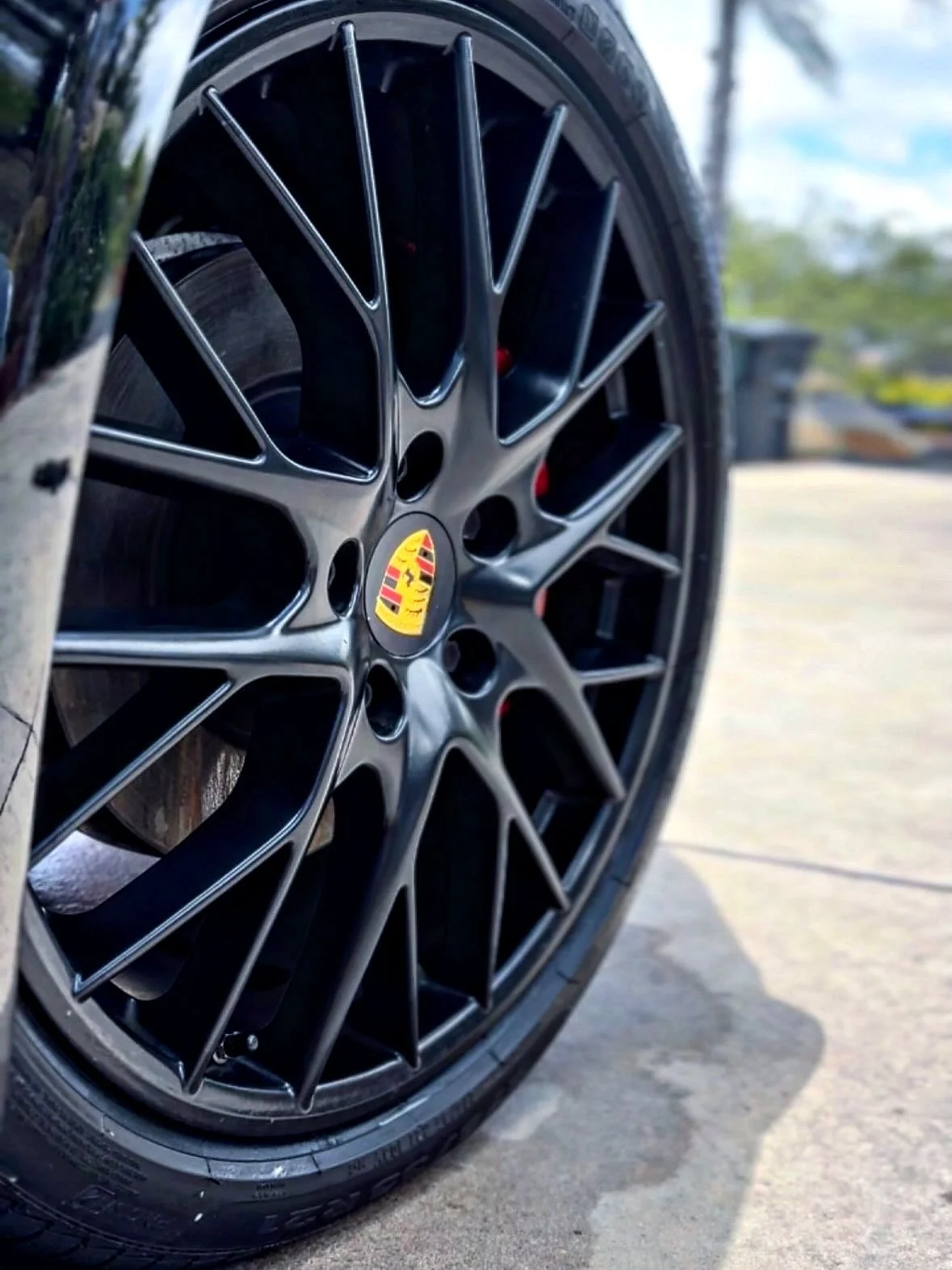 Porsche wheel with brake dust removed and dressed tire