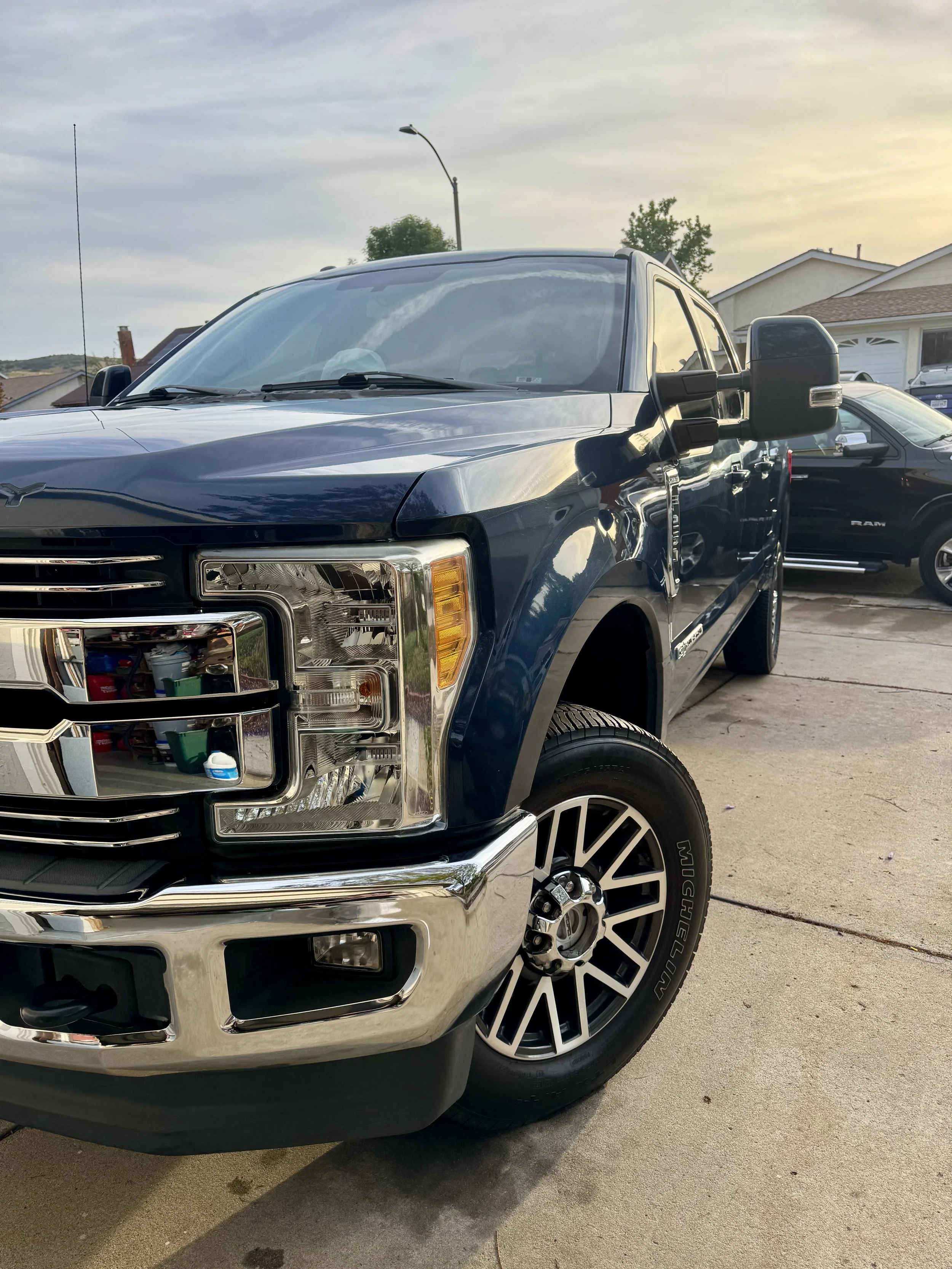 Blue Ford Super Duty truck with clean wheels and tire shine in Poway