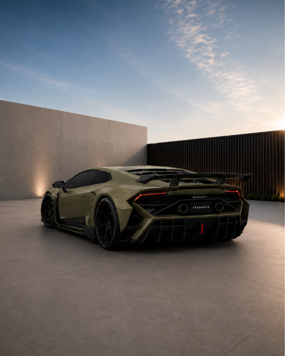 A matte olive green Esagerato Lamborghini with a large rear wing parked on a modern concrete surface at sunset, with minimalistic walls and a blue sky.