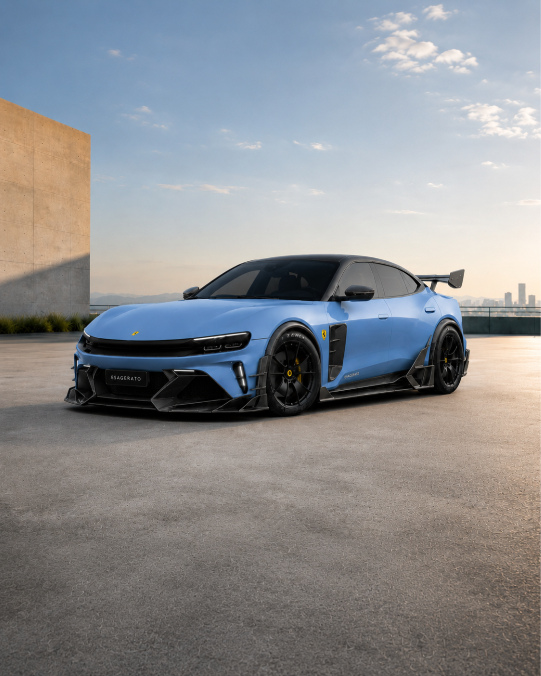 A sleek blue Ferrari Esagerato sports car with black accents and a large rear wing is parked on a rooftop with a city skyline in the background during sunset.