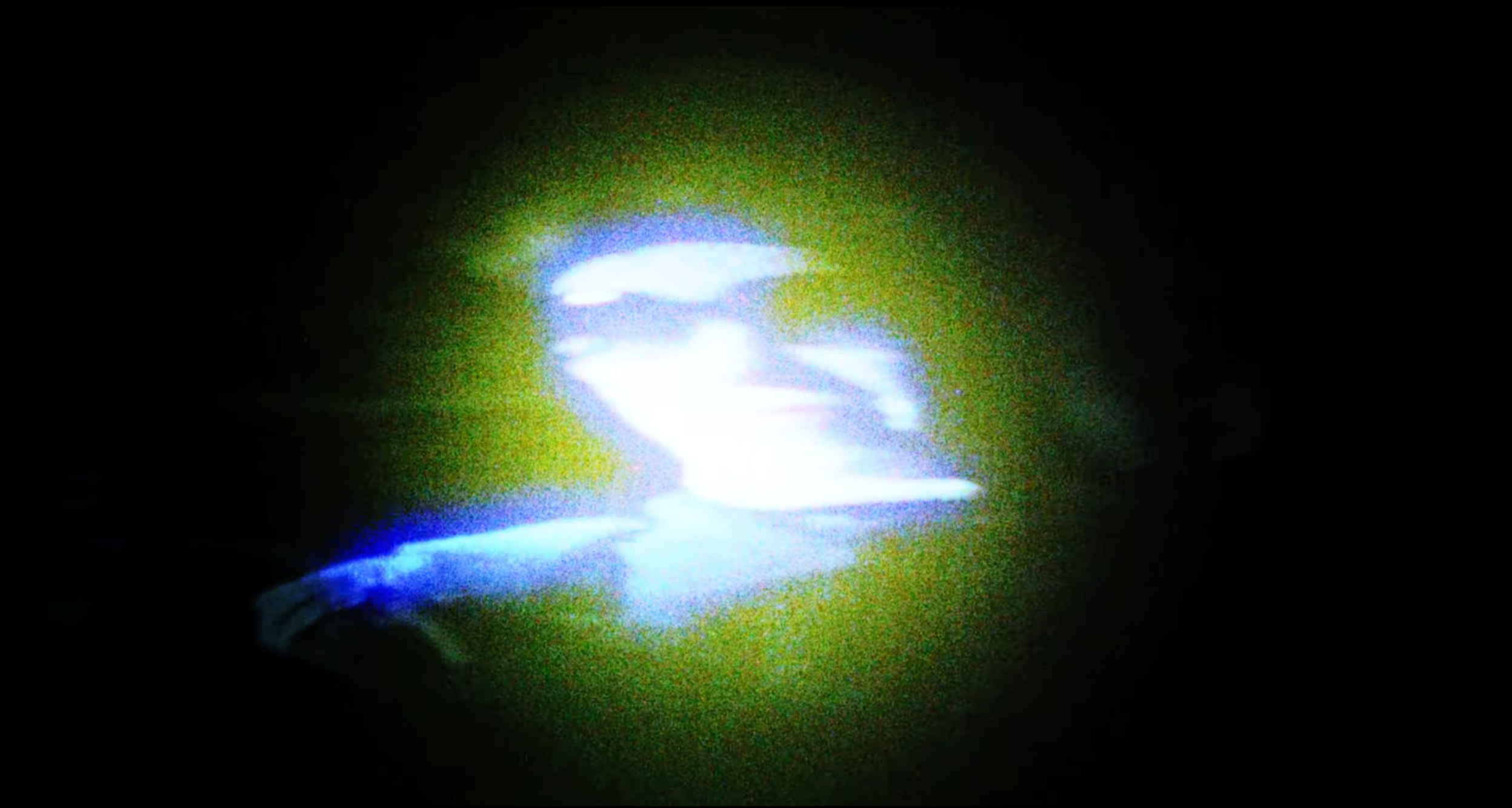Bright blue and white light streaks against a dark background, resembling an abstract or cosmic scene.