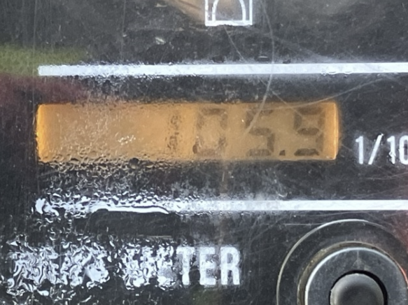 Close-up of a digital meter display showing the reading 7.53, with condensation and water droplets on the surface.