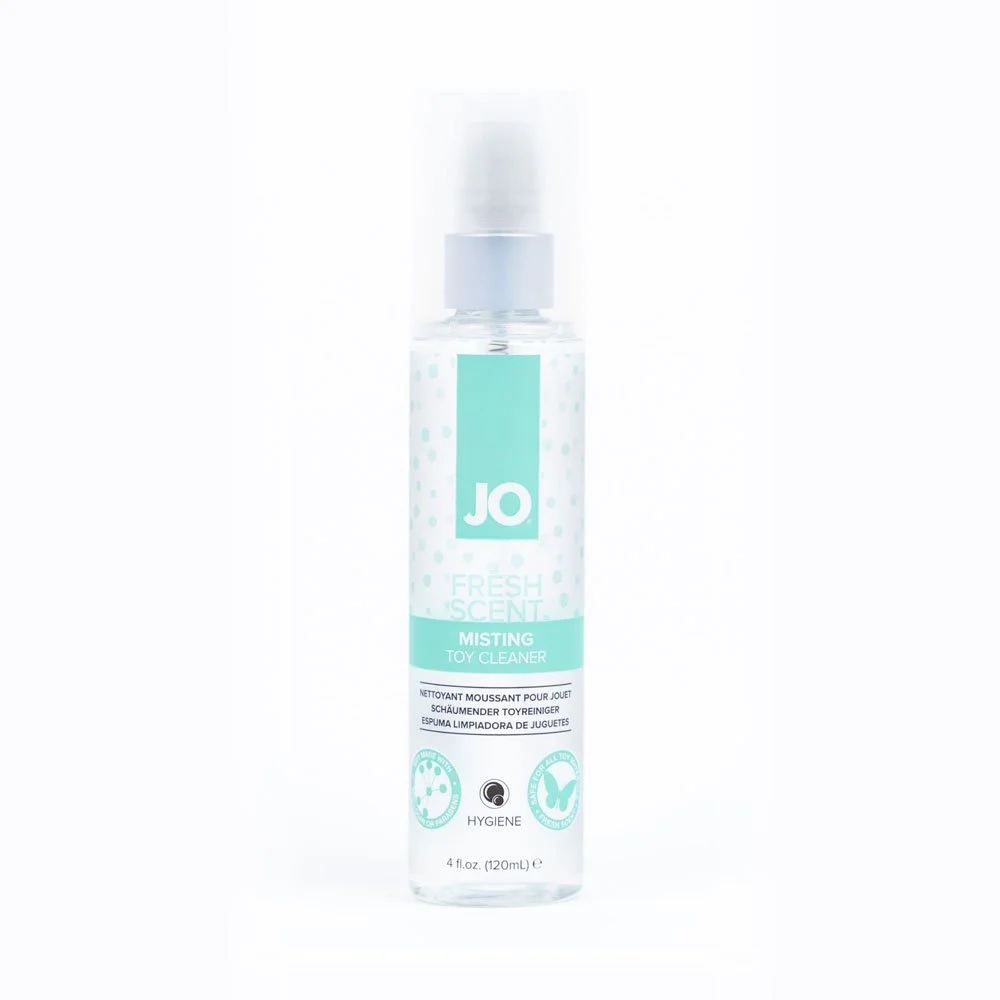 A clear spray bottle labeled 'JO Fresh Scent Misting Toy Cleaner' with blue and white packaging.