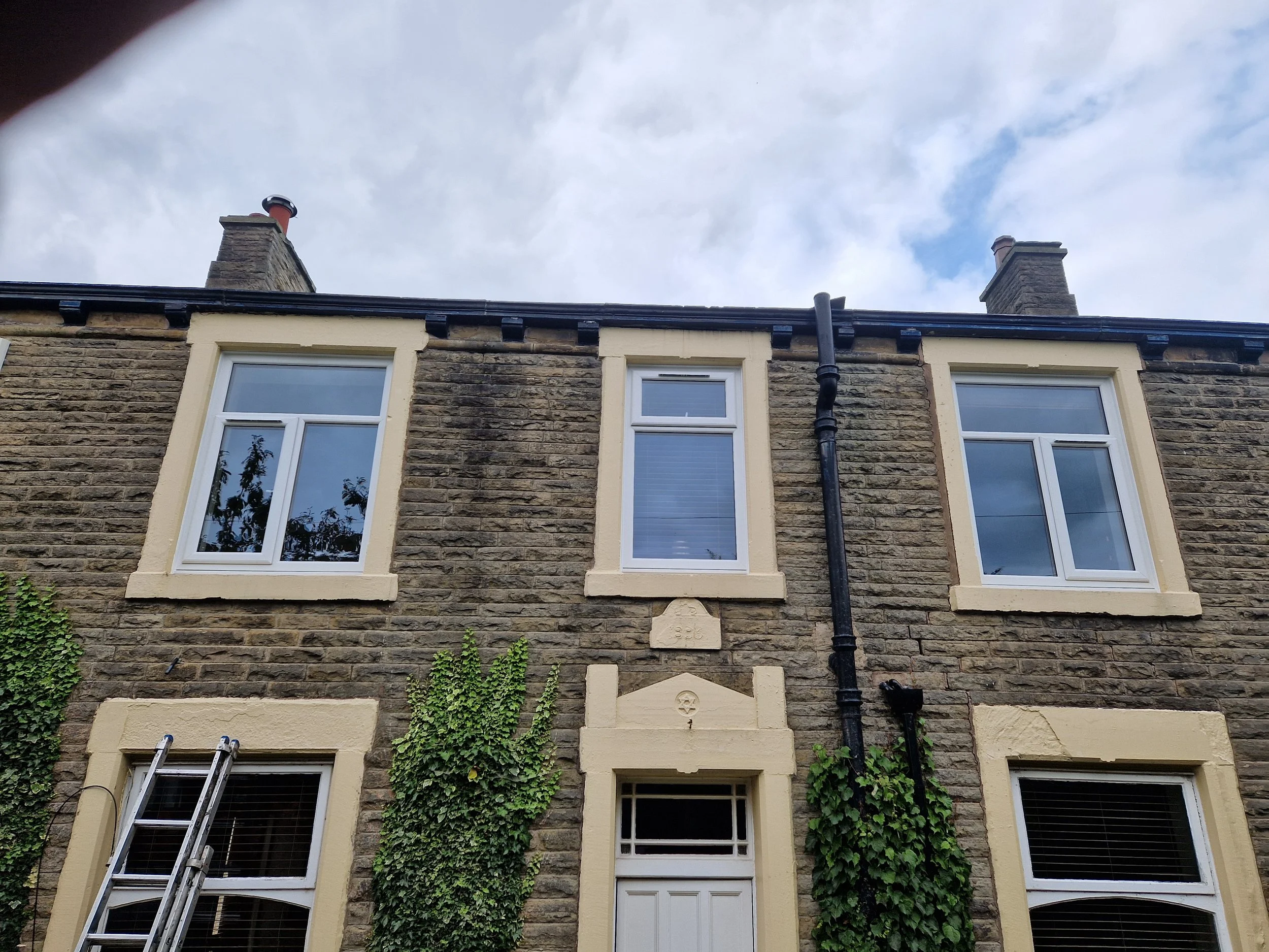 White uPVC window replacement, completely upgrading the front of the property by removing rotten wooden frames. These durable, low-maintenance PVC windows eliminate ongoing painting and repairs while drastically improving home security and thermal ef