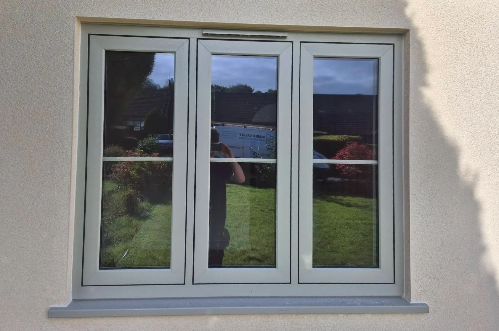 Energy efficient uPVC flush sash window in pebble grey with astrigal bars, fitted in Langho