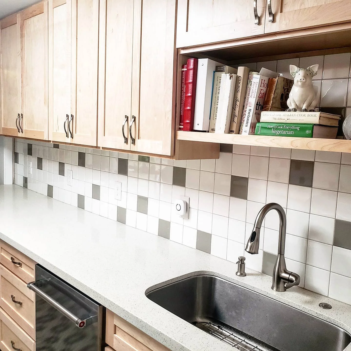 Unique Pinehurst, Seattle galley kitchen with vibrant tiled flooring and fun backsplash.