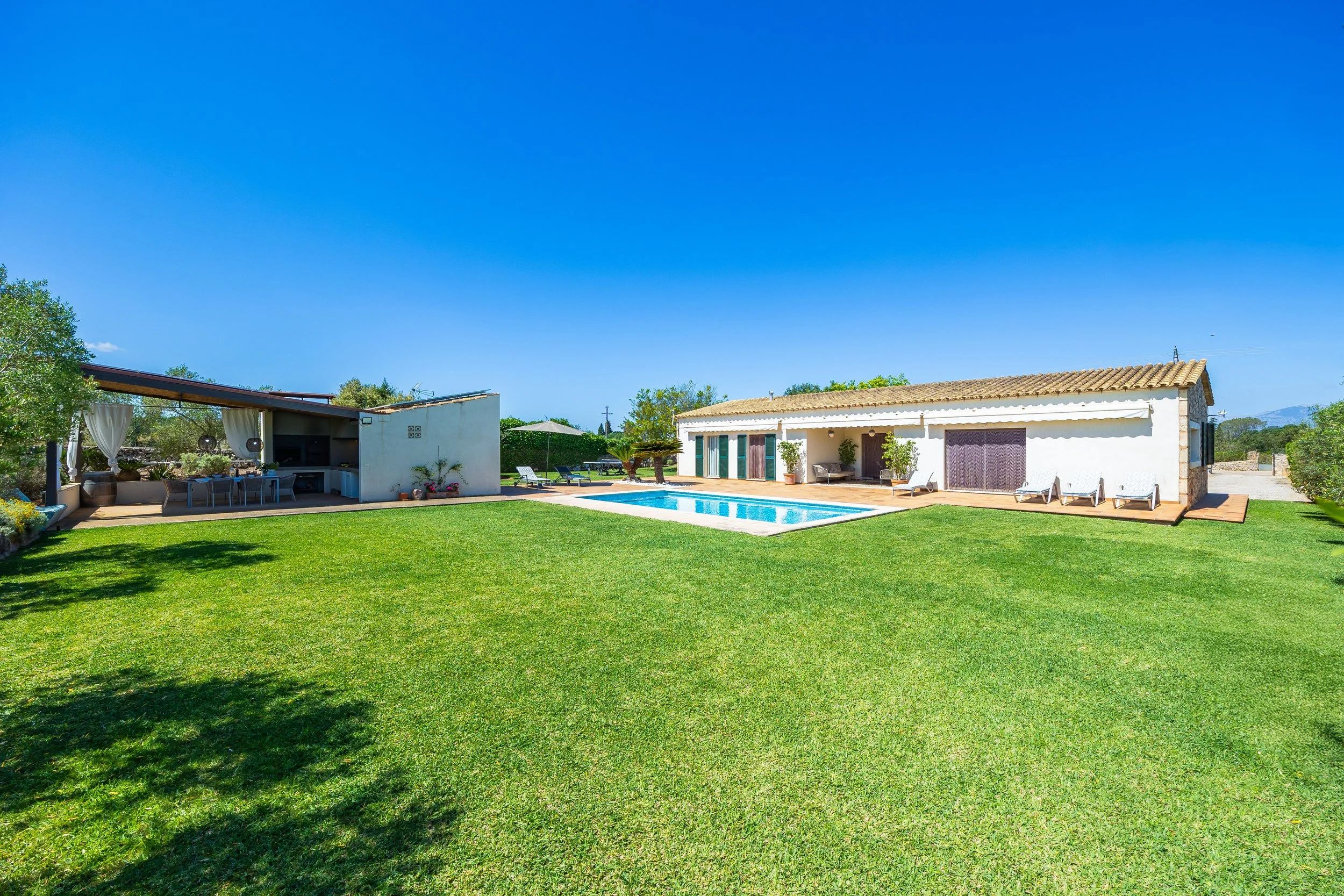 Sa Finca Mallorca finca exterior with pool, garden and family leisure area real estate photography