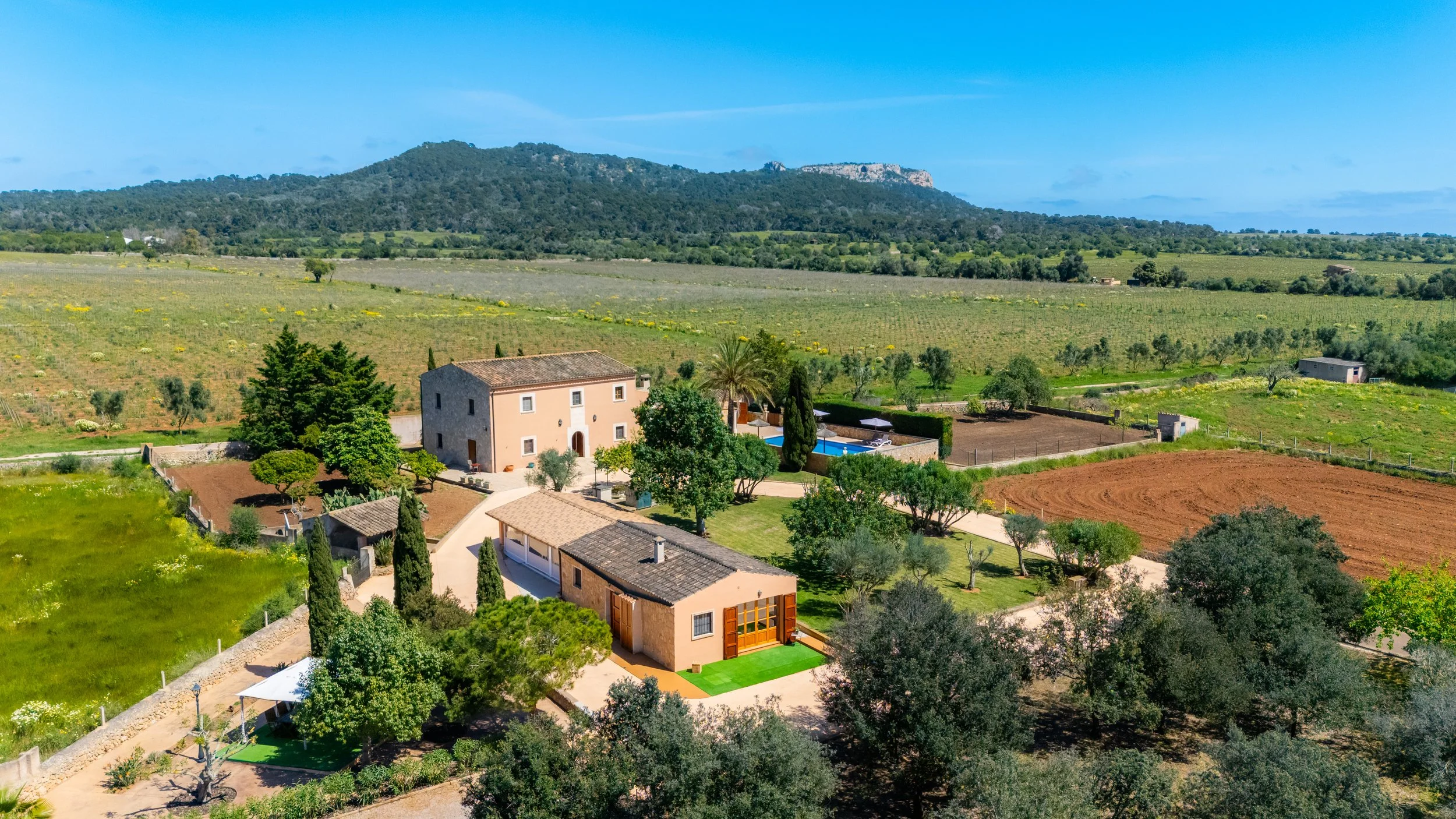 Aerial drone photography of Cas Cuni Mallorca traditional property surrounded by countryside landscape