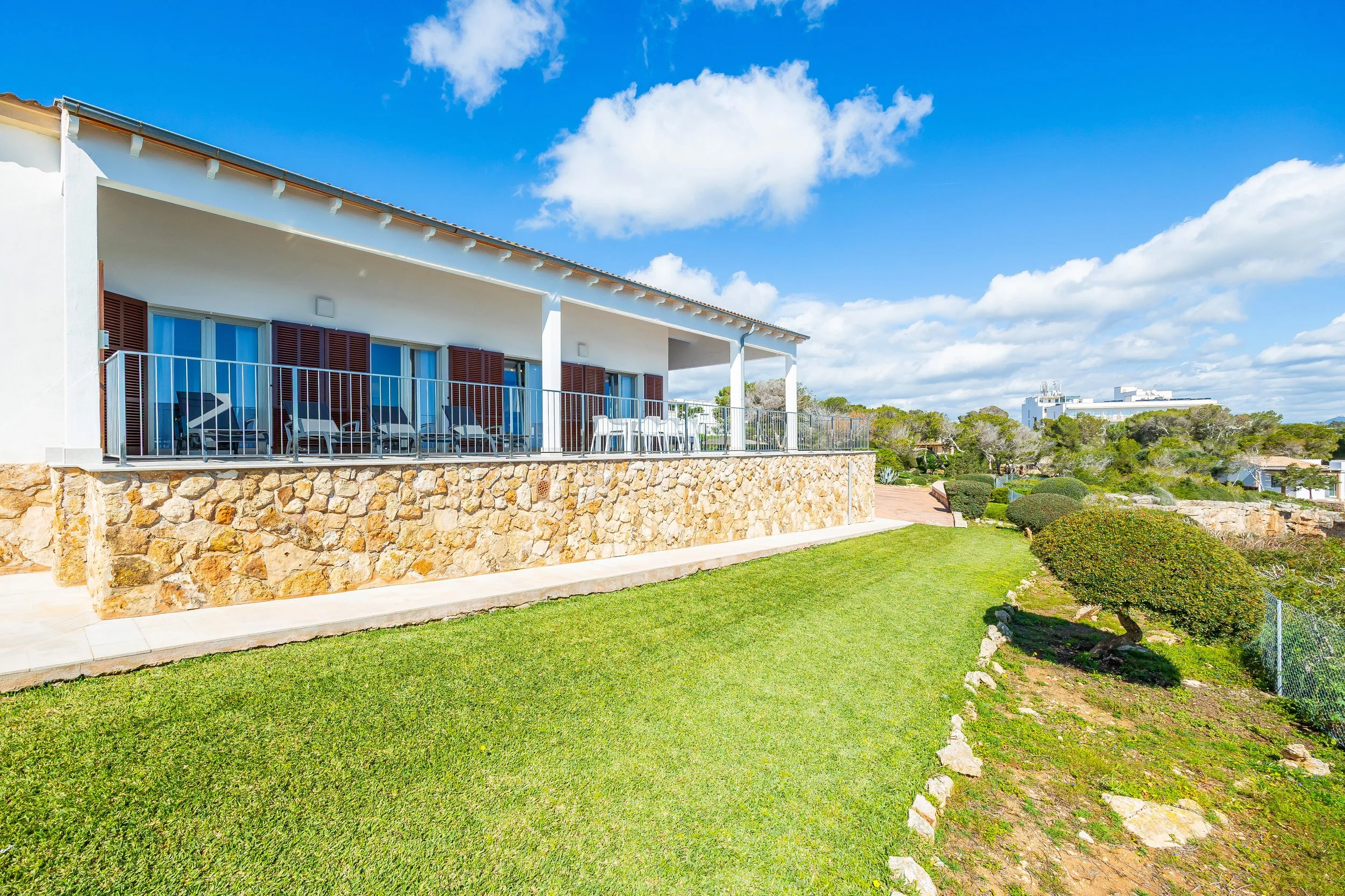 Cinematic real estate photography of Can Fernando Es Pontàs Mallorca with direct views over Es Pontàs natural arch and coastline