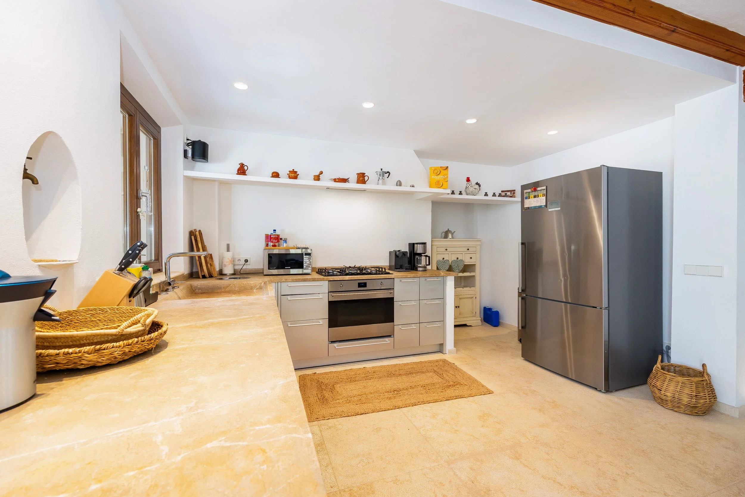 Sa Papaiona Mallorca traditional finca interior with rustic architecture and natural light real estate photography