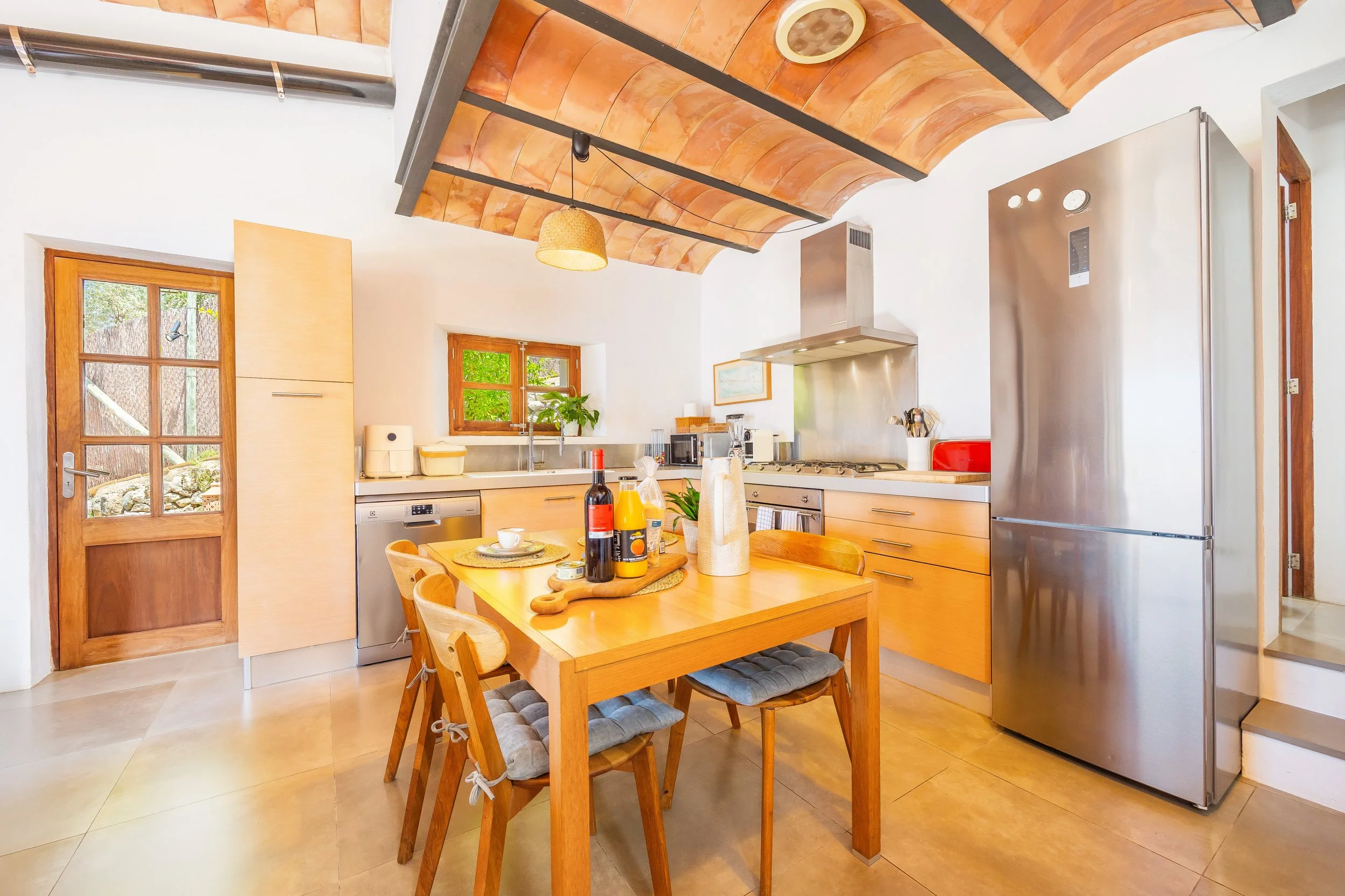 Mountain house interior near Sóller Mallorca renovated with natural light and modern rustic style real estate photography