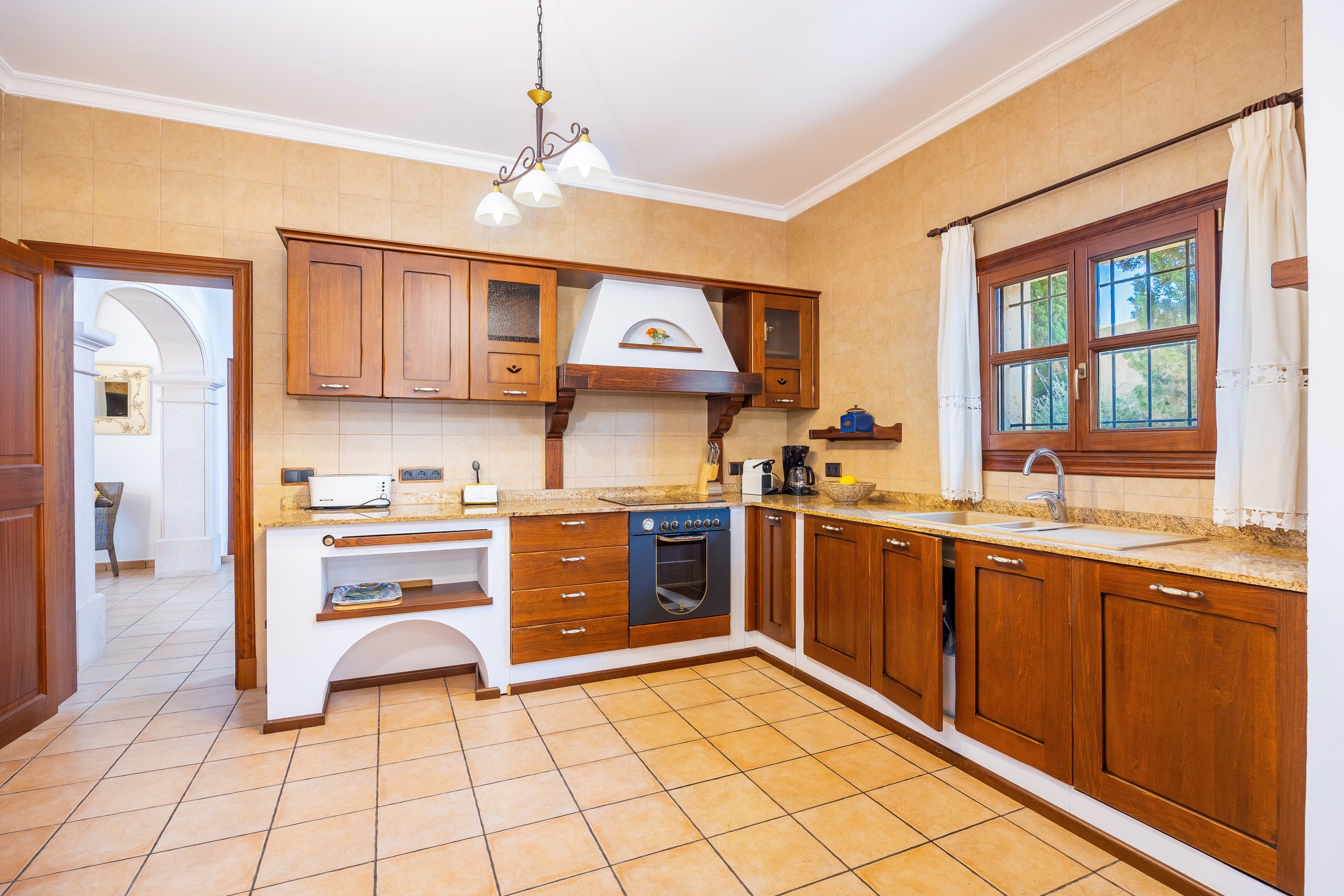 Traditional interior of Cas Cuni Mallorca with rustic architecture and natural light real estate photography