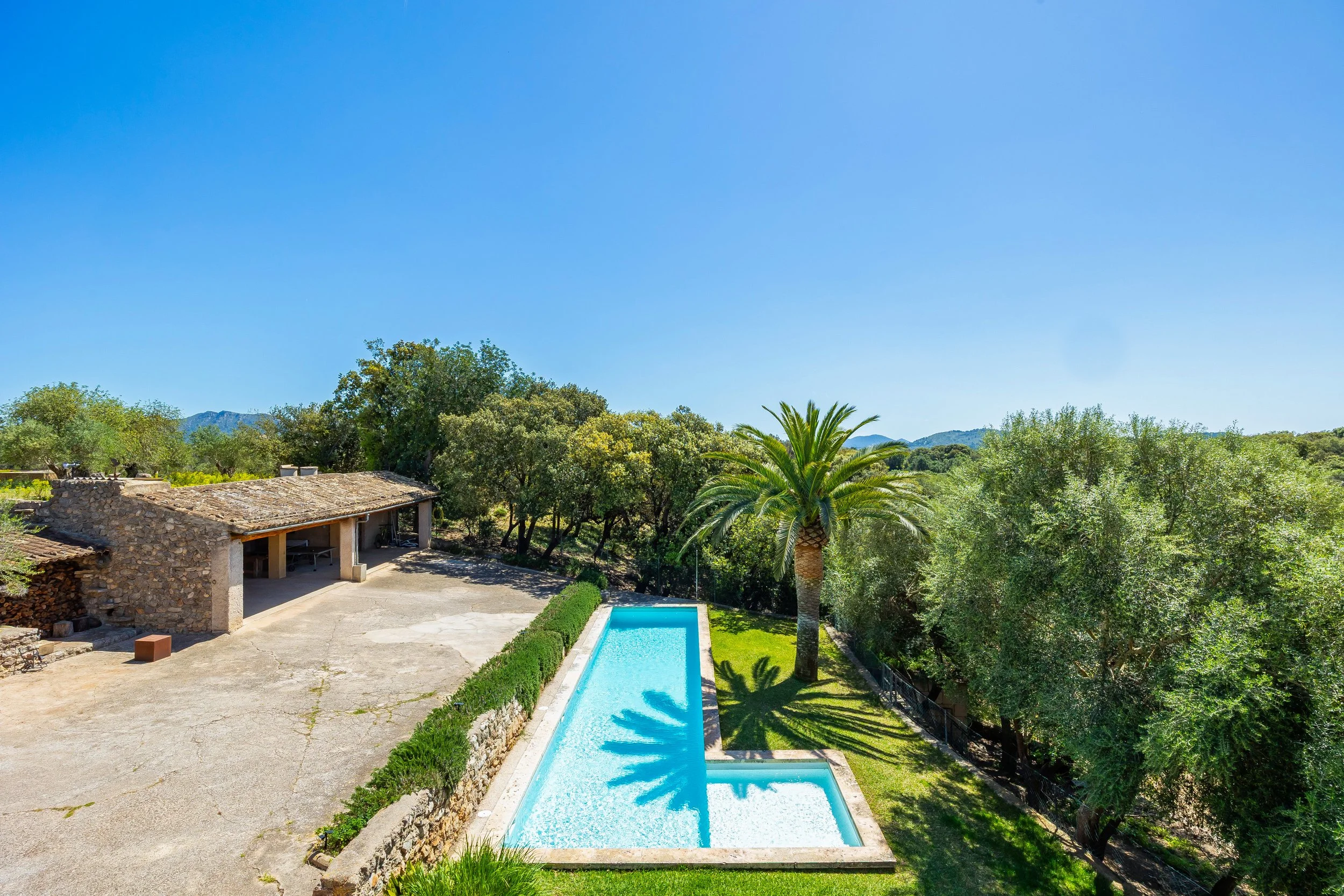 Traditional Mallorcan house with swimming pool near Artà surrounded by countryside real estate photography