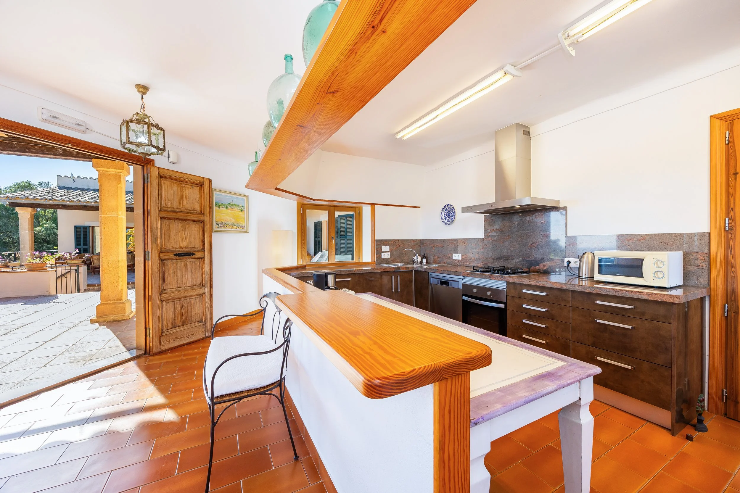 Traditional Mallorcan finca interior photography with natural light and rustic details