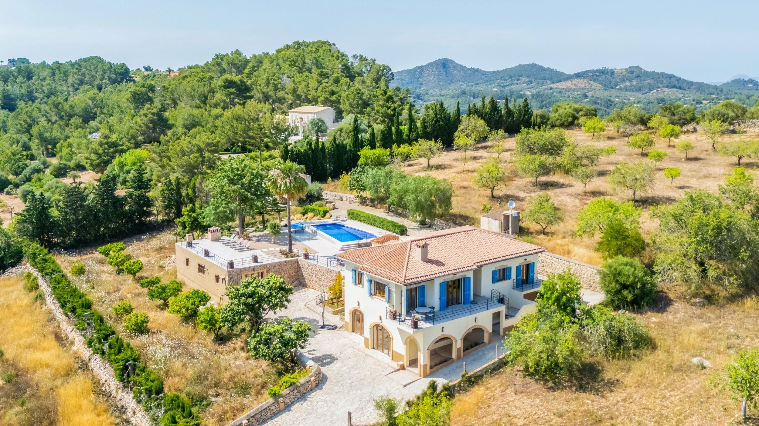 Aerial drone photography of Can Gomez Mallorca countryside house with pool and panoramic views over Calas de Mallorca coastline