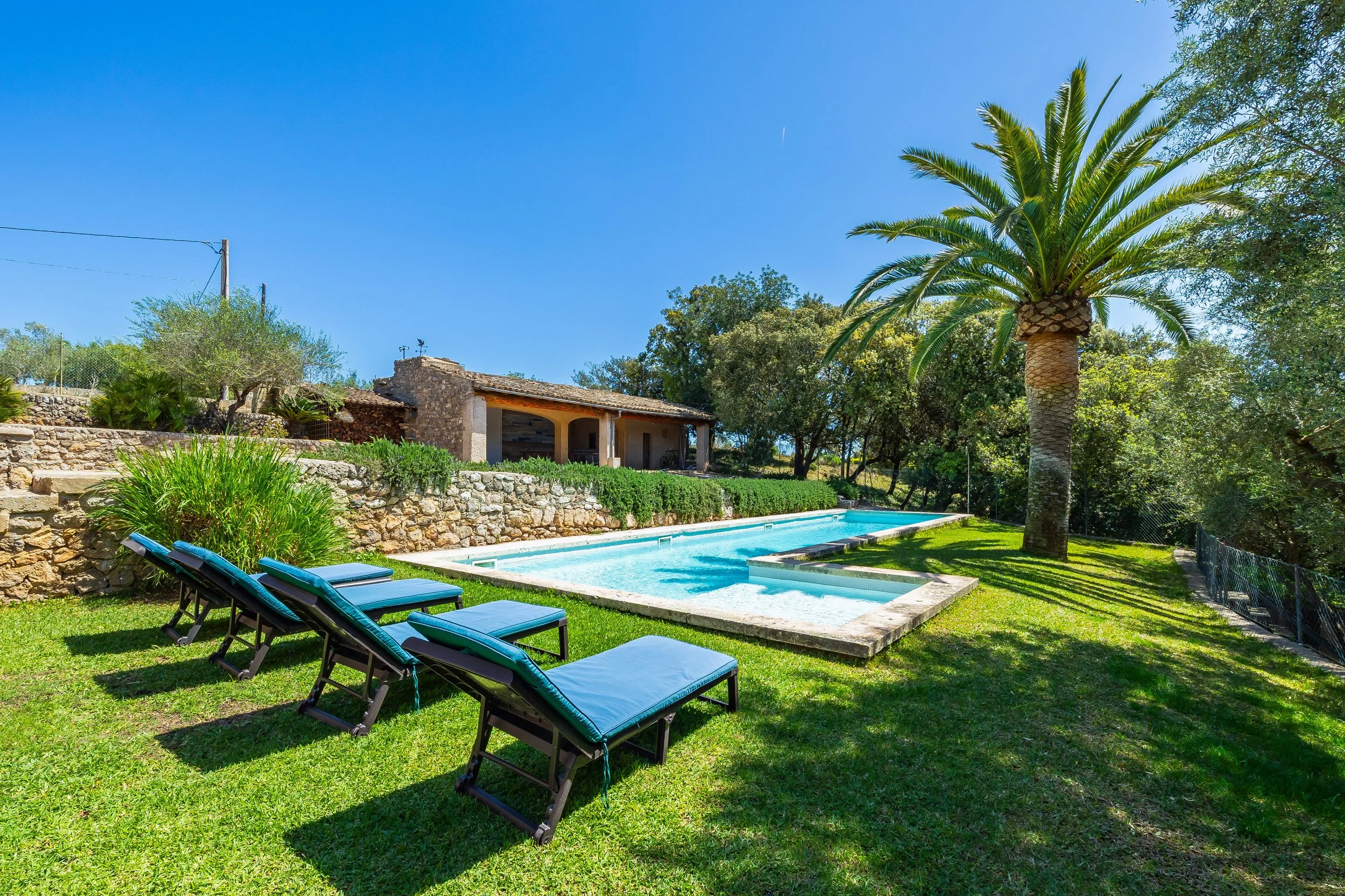 Traditional Mallorcan house with swimming pool near Artà surrounded by countryside real estate photography