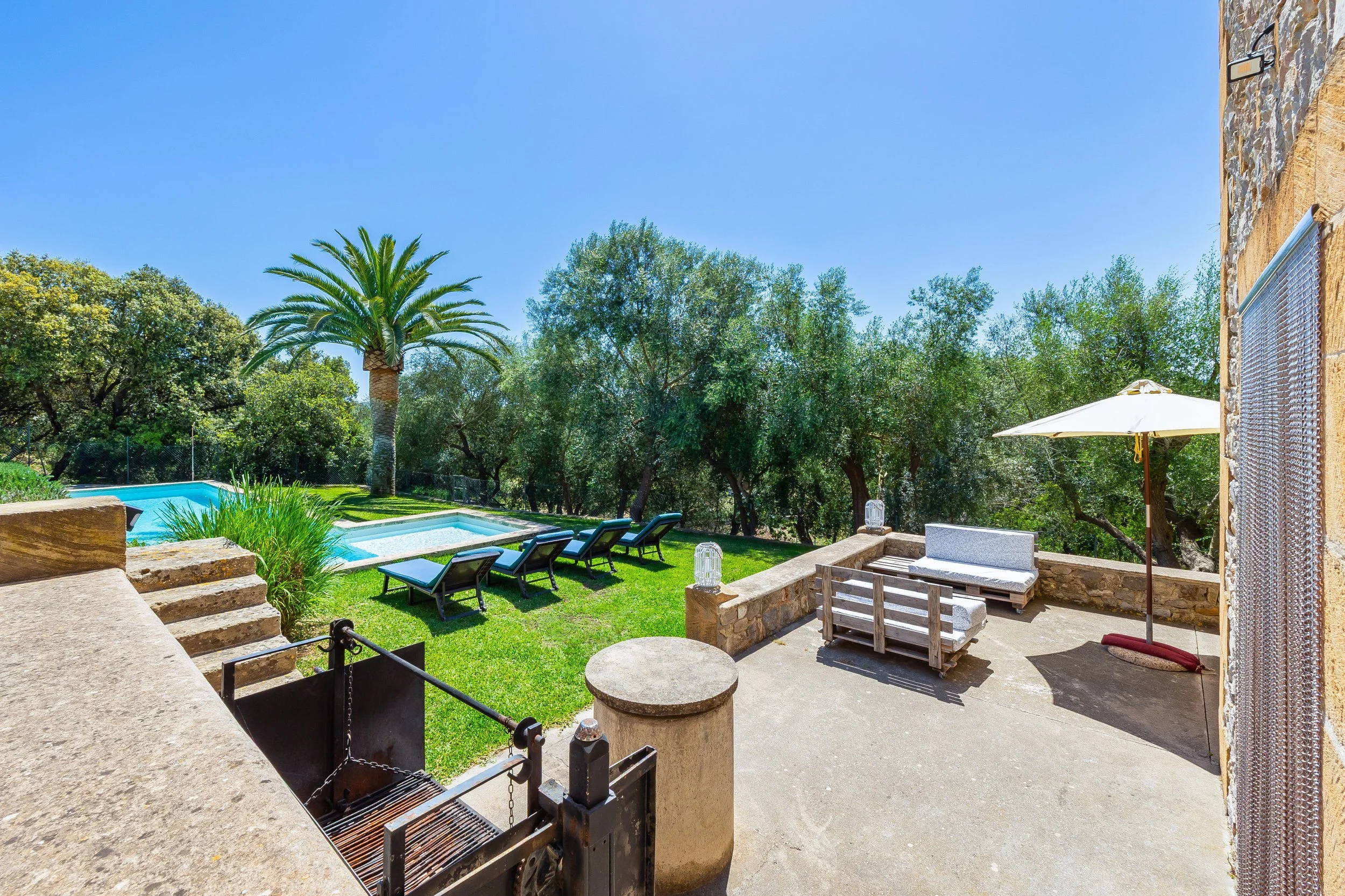 Traditional Mallorcan house with swimming pool near Artà surrounded by countryside real estate photography