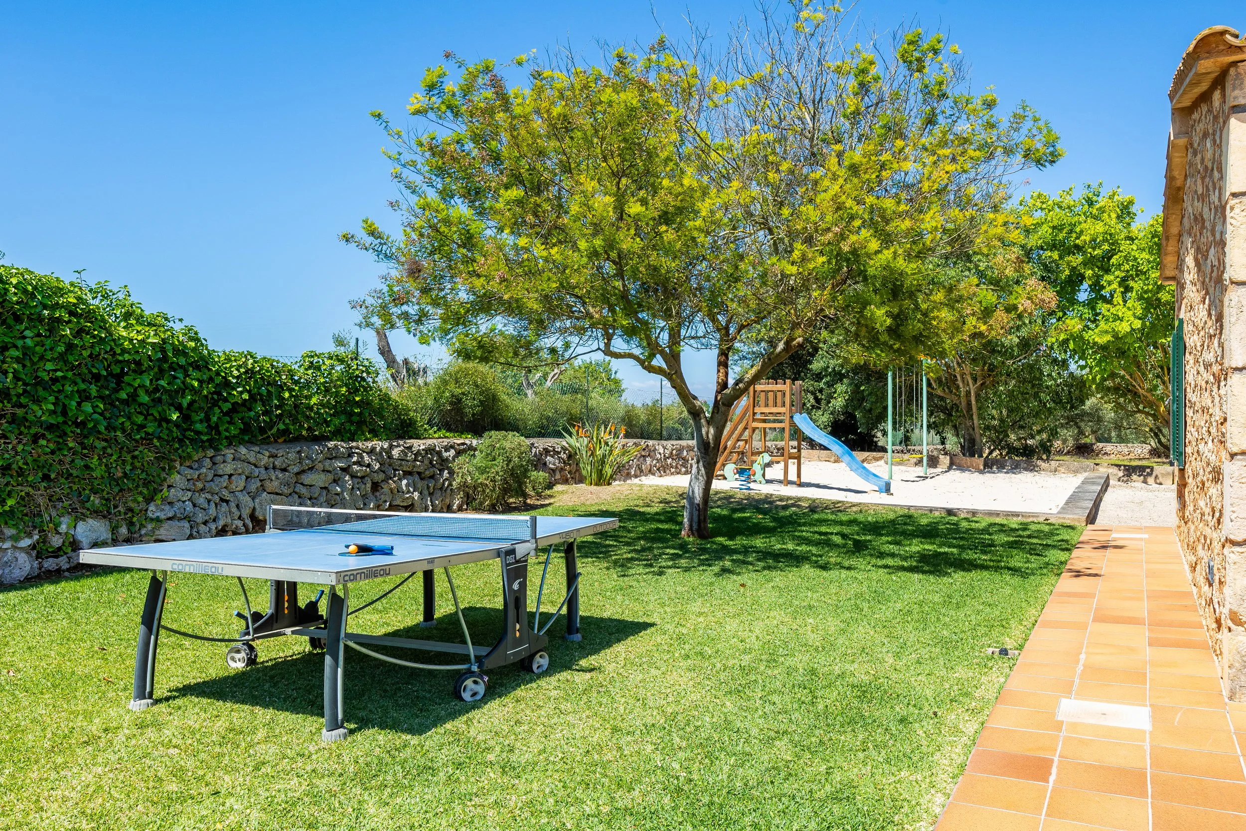 Sa Finca Mallorca finca exterior with pool, garden and family leisure area real estate photography
