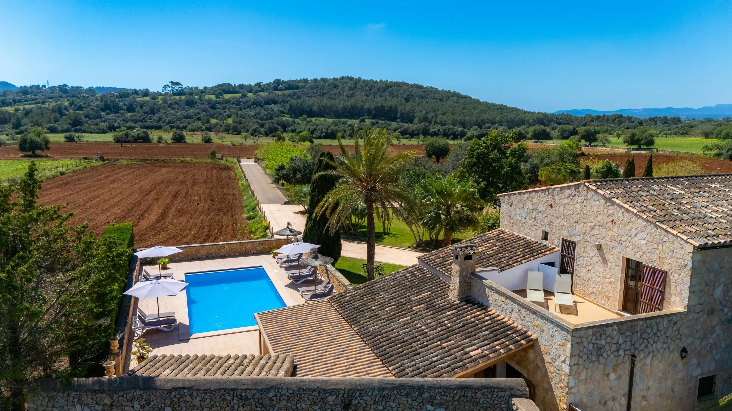 Aerial drone photography of Cas Cuni Mallorca traditional property surrounded by countryside landscape