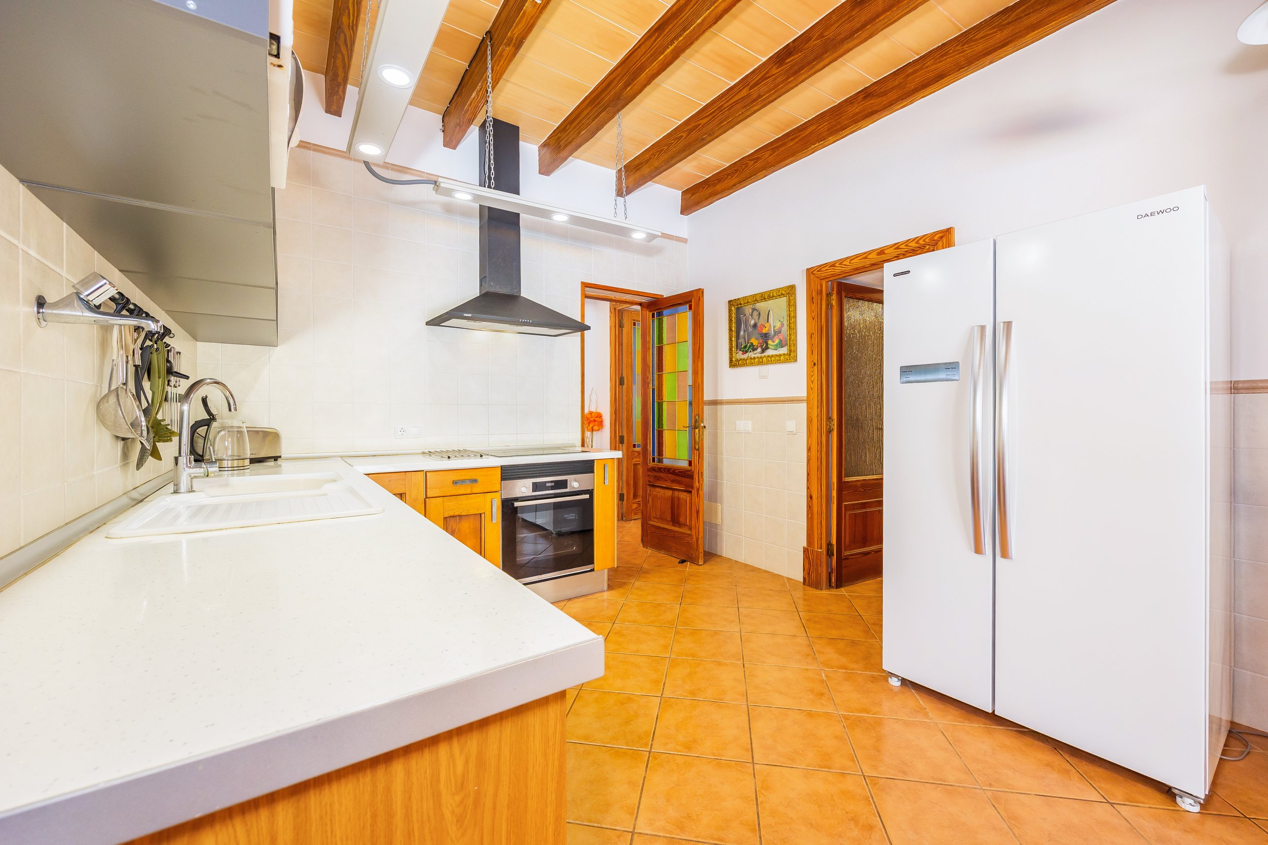 Traditional Mallorcan interior at Can Churi with rustic details and natural light real estate photography