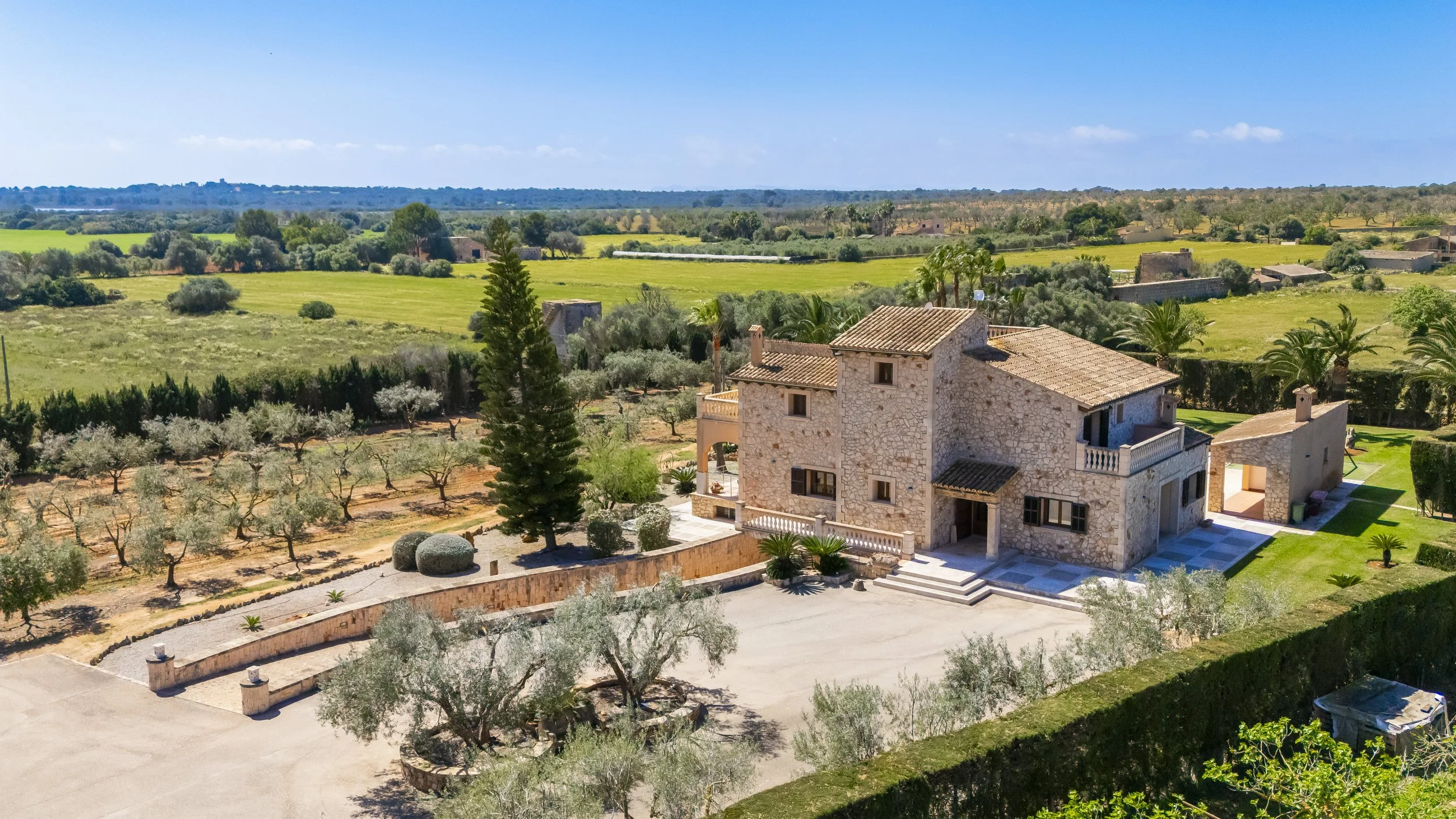 Aerial drone photography of rural house near Ses Salines Mallorca with private pool and garden
