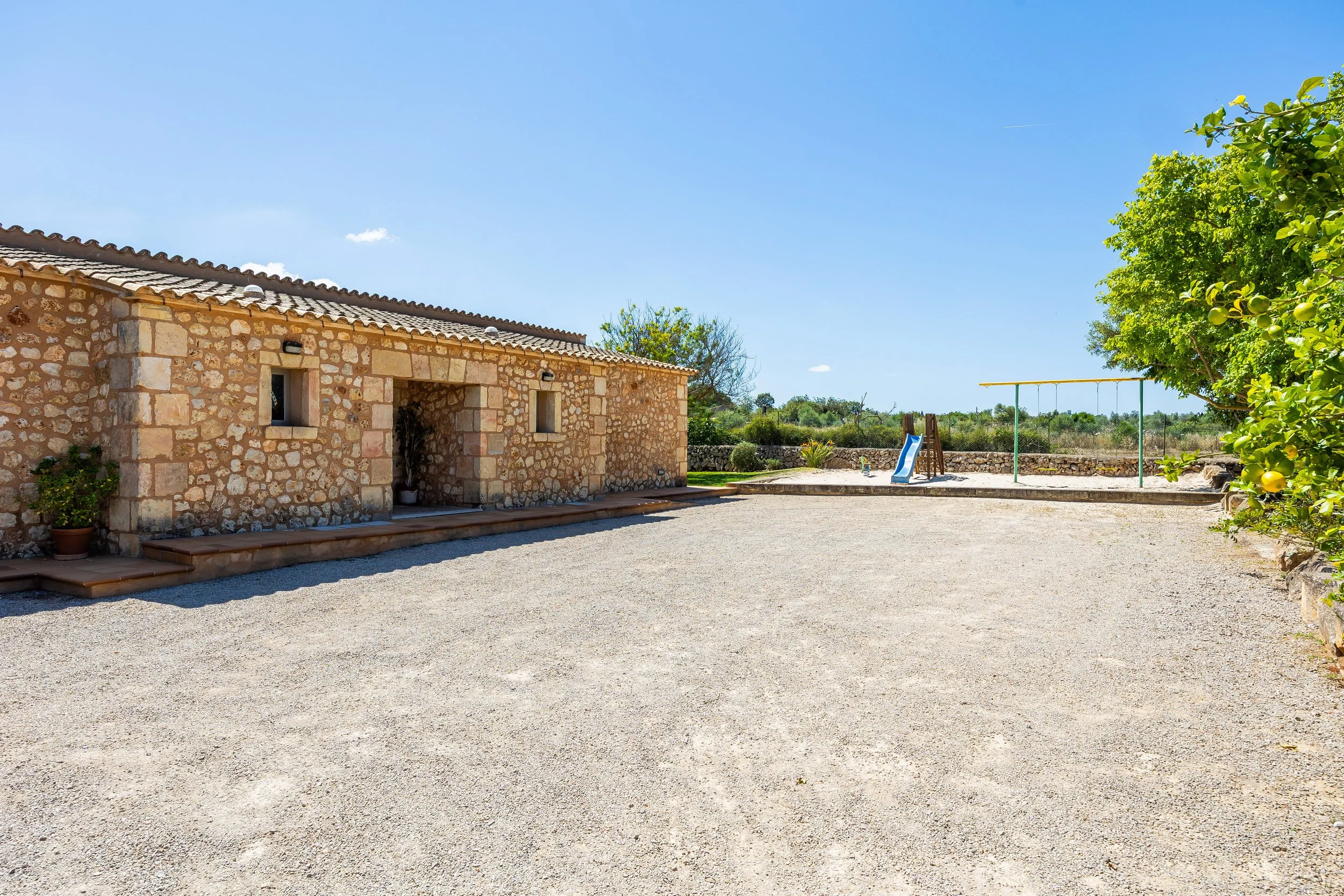 Sa Finca Mallorca finca exterior with pool, garden and family leisure area real estate photography
