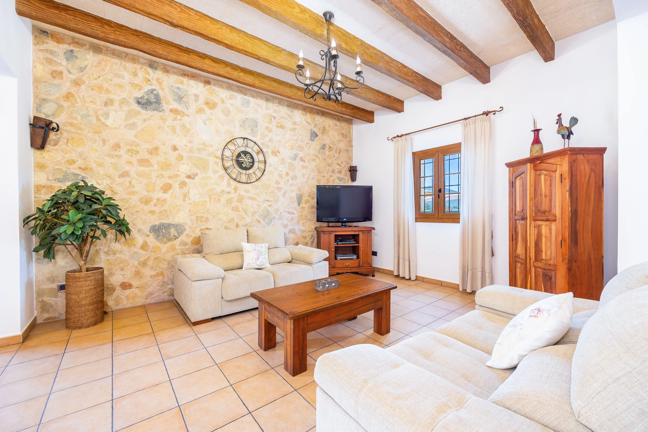 Traditional interior of Cas Cuni Mallorca with rustic architecture and natural light real estate photography