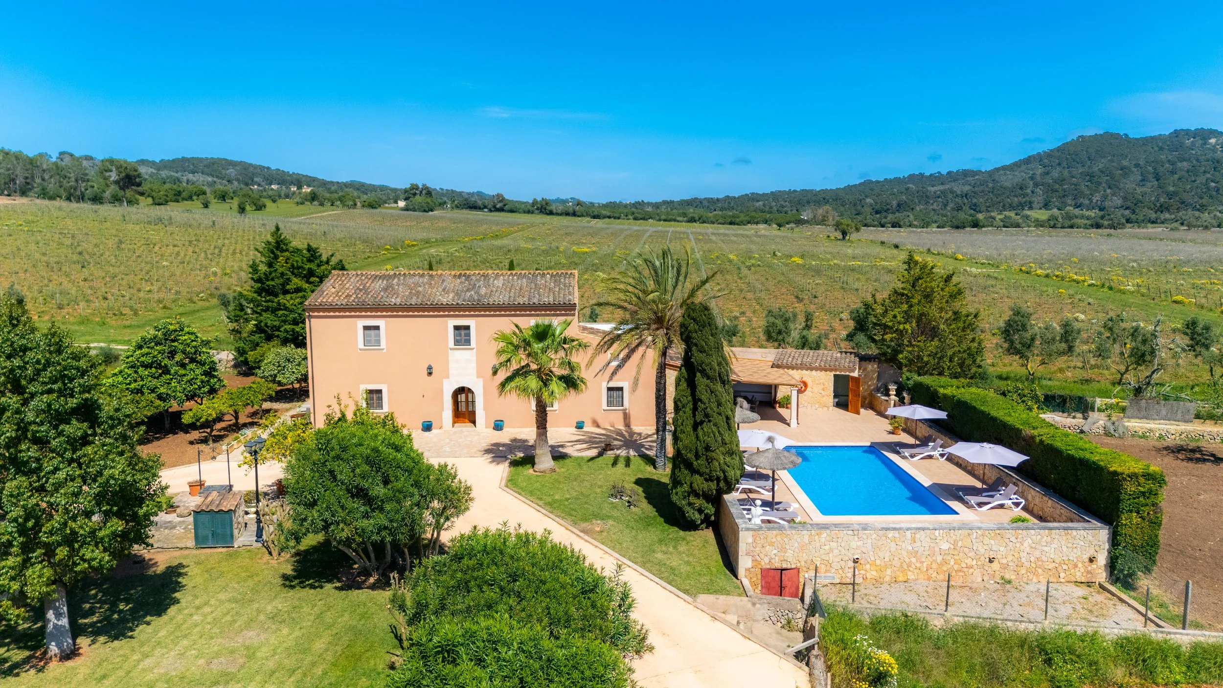 Aerial drone photography of Cas Cuni Mallorca traditional property surrounded by countryside landscape