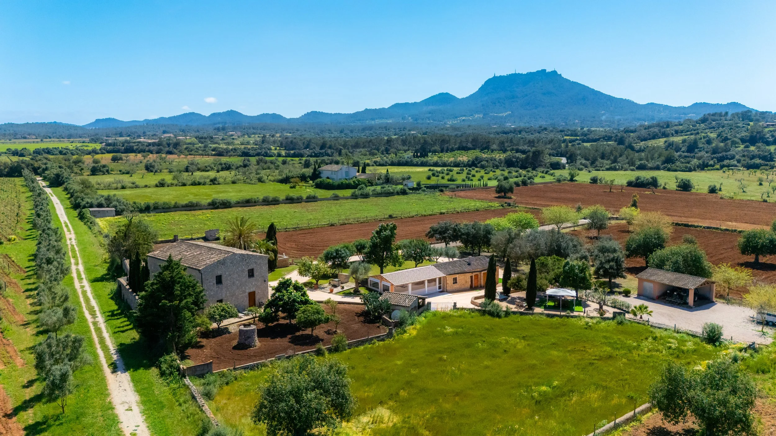 Aerial drone photography of Cas Cuni Mallorca traditional property surrounded by countryside landscape