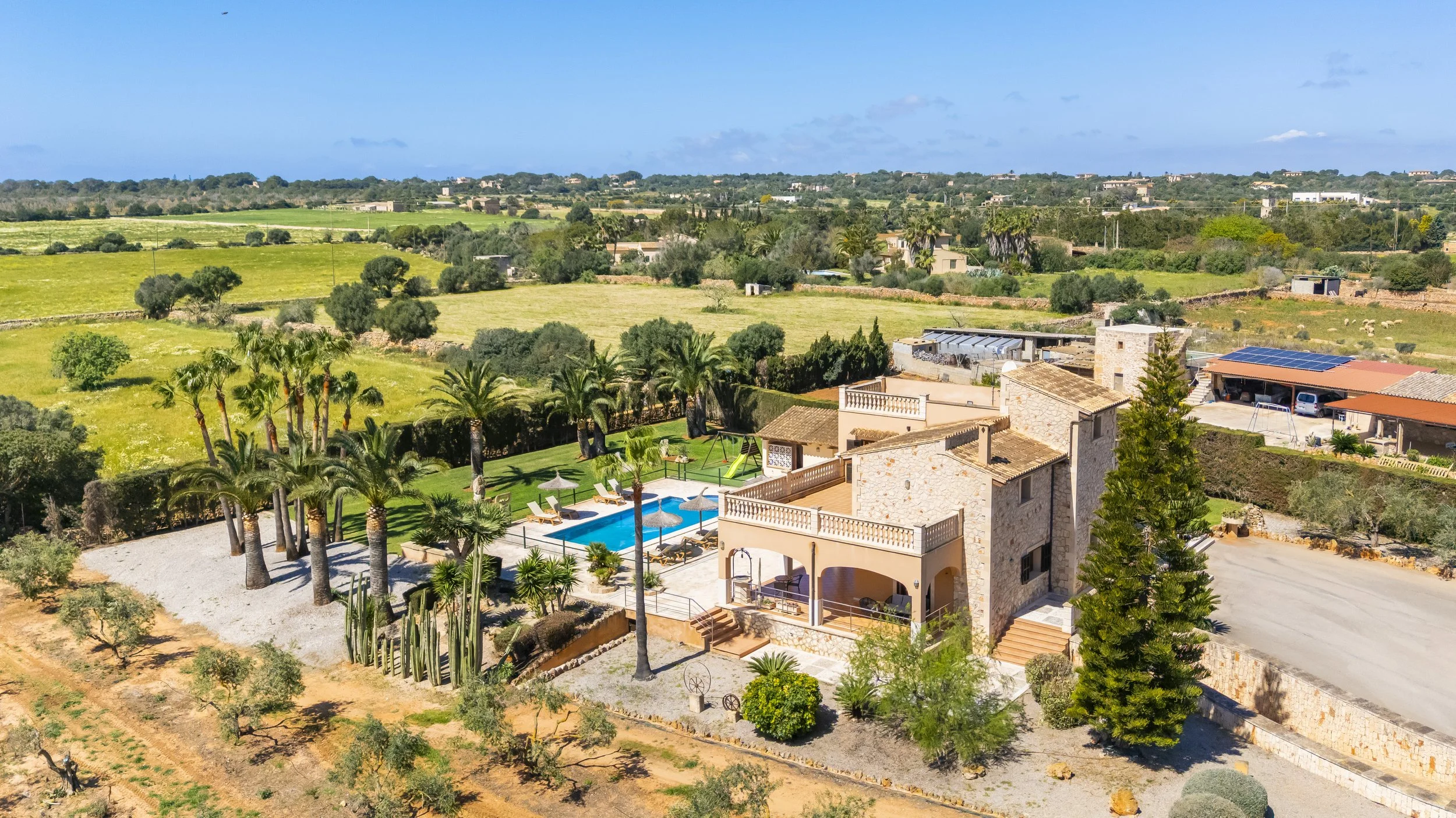 Aerial drone photography of rural house near Ses Salines Mallorca with private pool and garden
