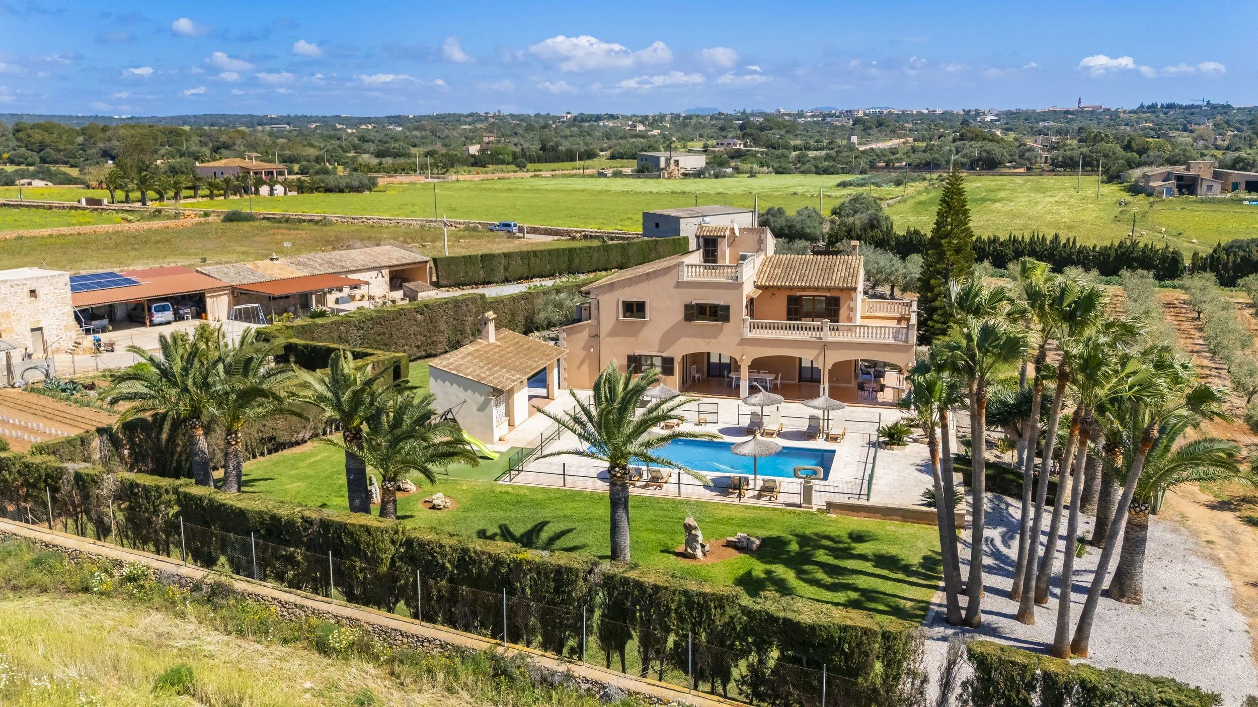 Aerial drone photography of rural house near Ses Salines Mallorca with private pool and garden