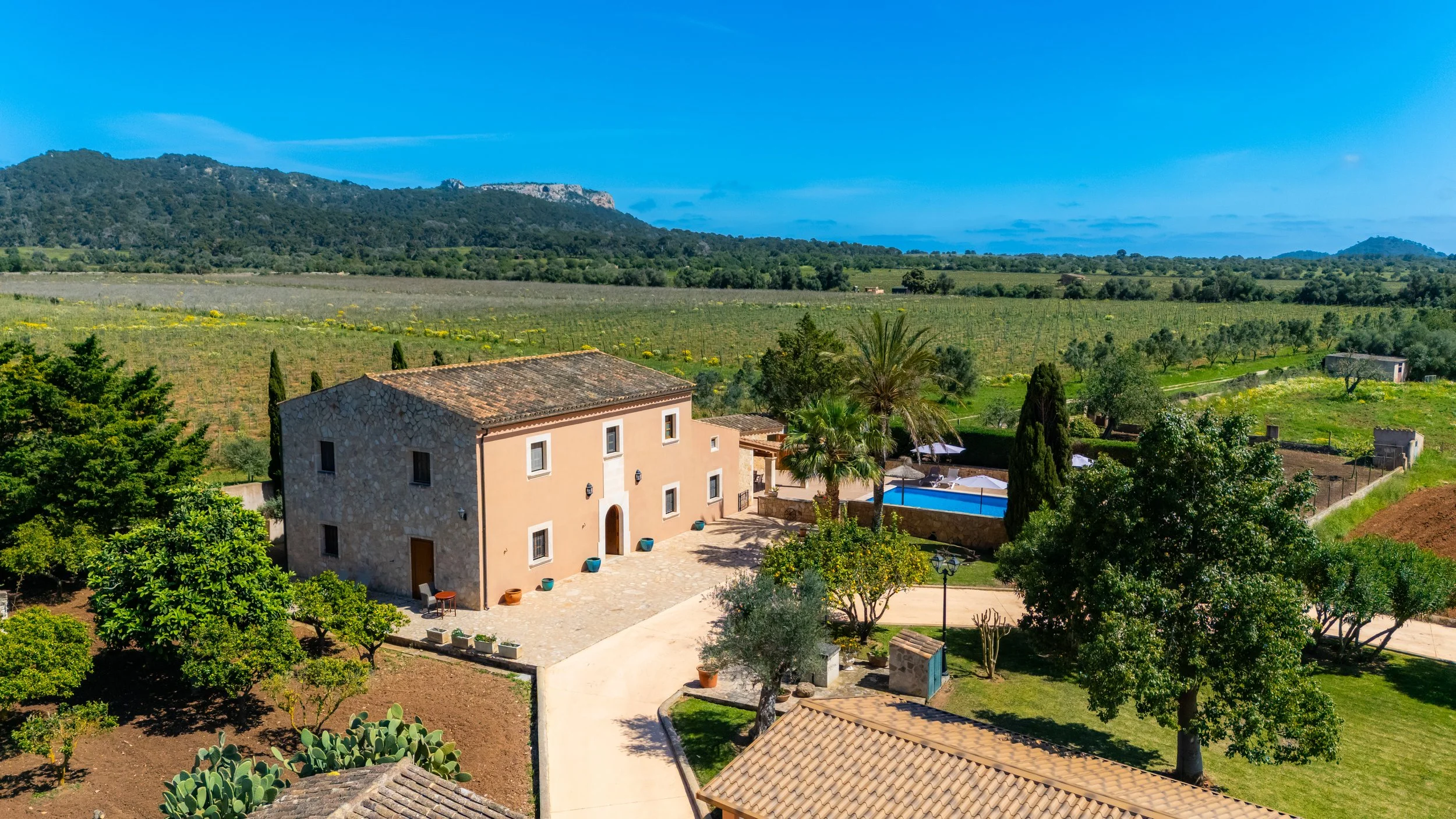 Aerial drone photography of Cas Cuni Mallorca traditional property surrounded by countryside landscape