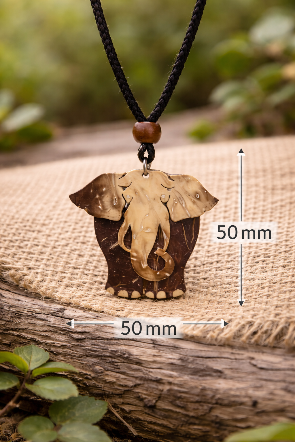 Handcrafted coconut elephant pendant.png
