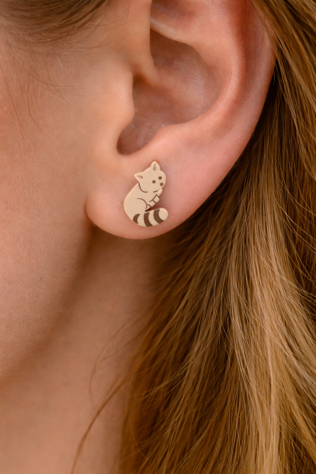Cat stud earring detail shot.png
