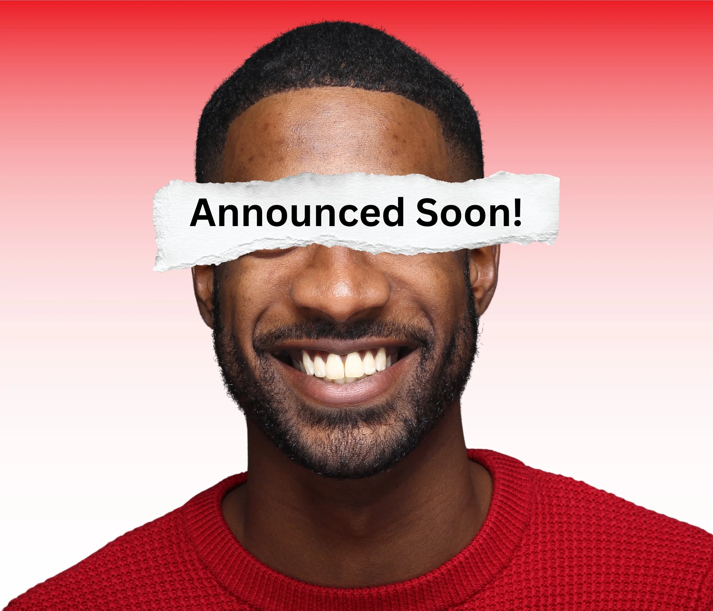 Smiling man wearing a red shirt with a torn paper label across his eyes that reads "Announced Soon!" against a gradient pink background.